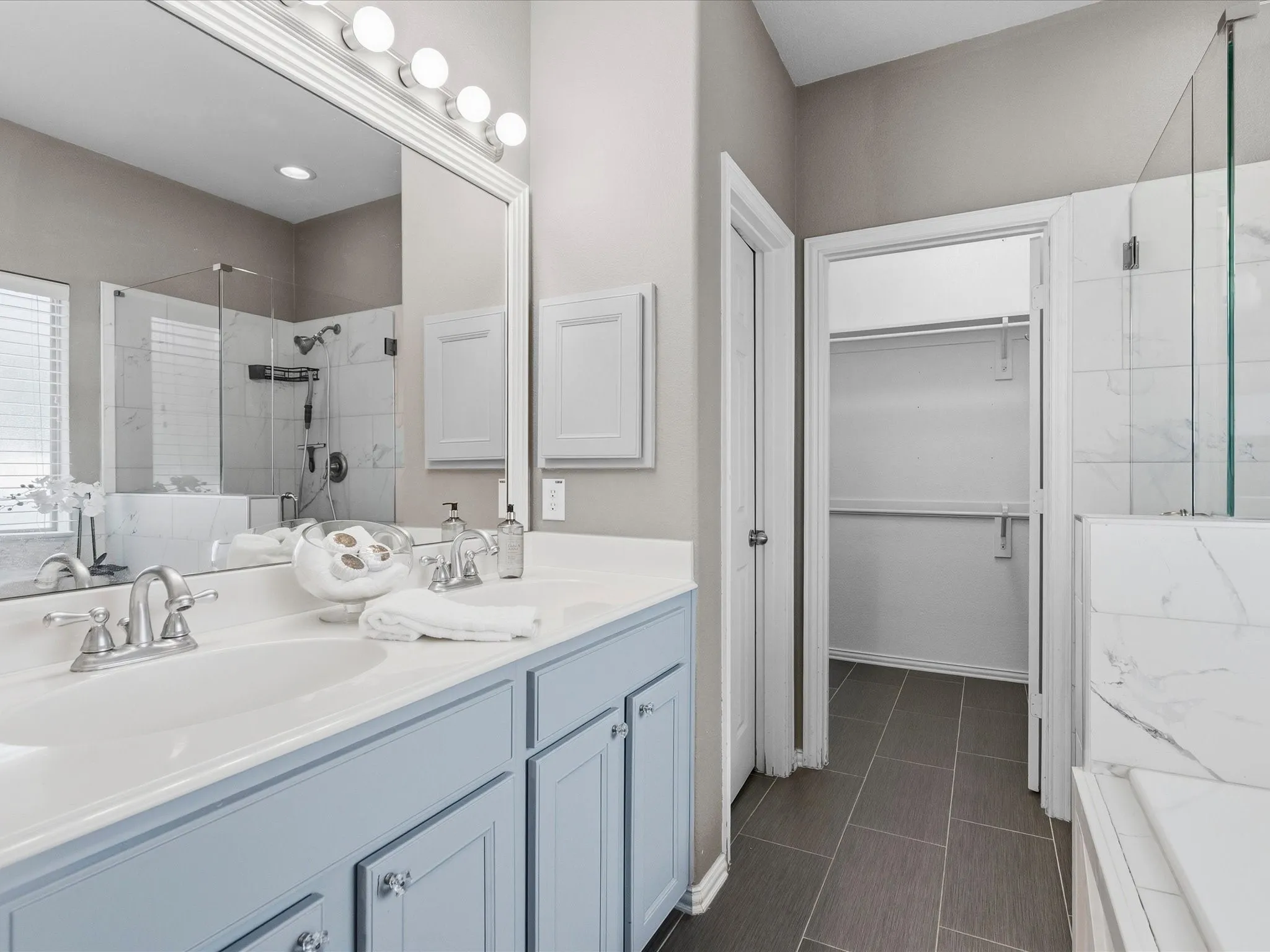 Beautifully updated primary bathroom with separate tub and shower and double sinks