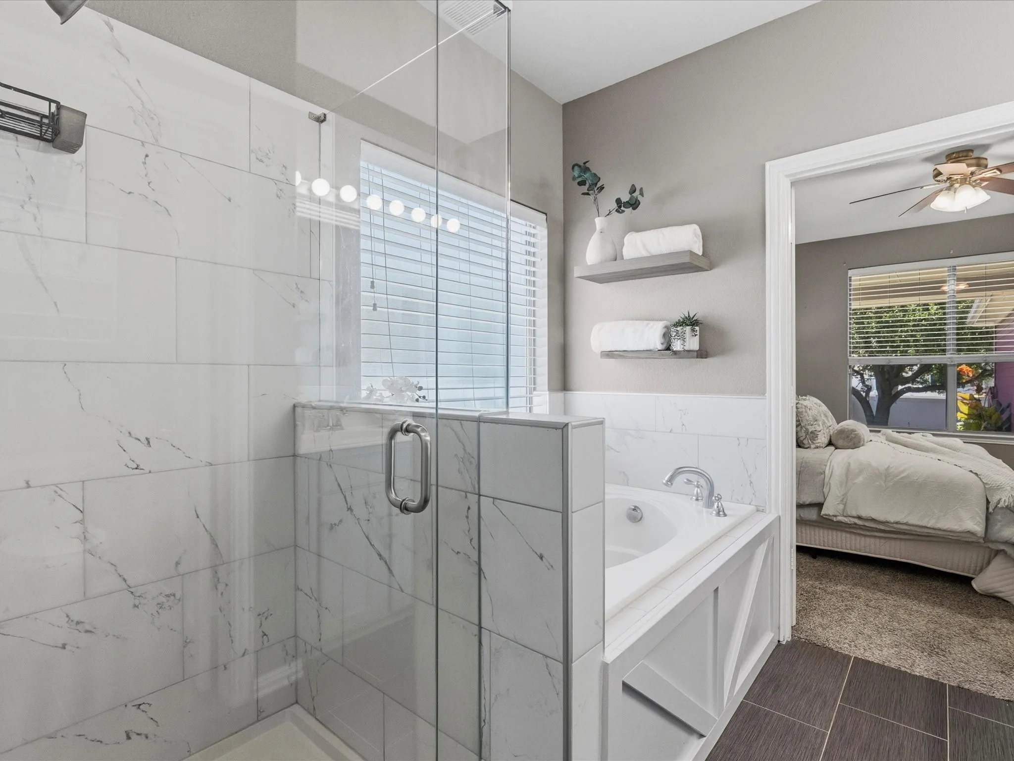 Beautifully updated primary bathroom with separate tub and shower and double sinks
