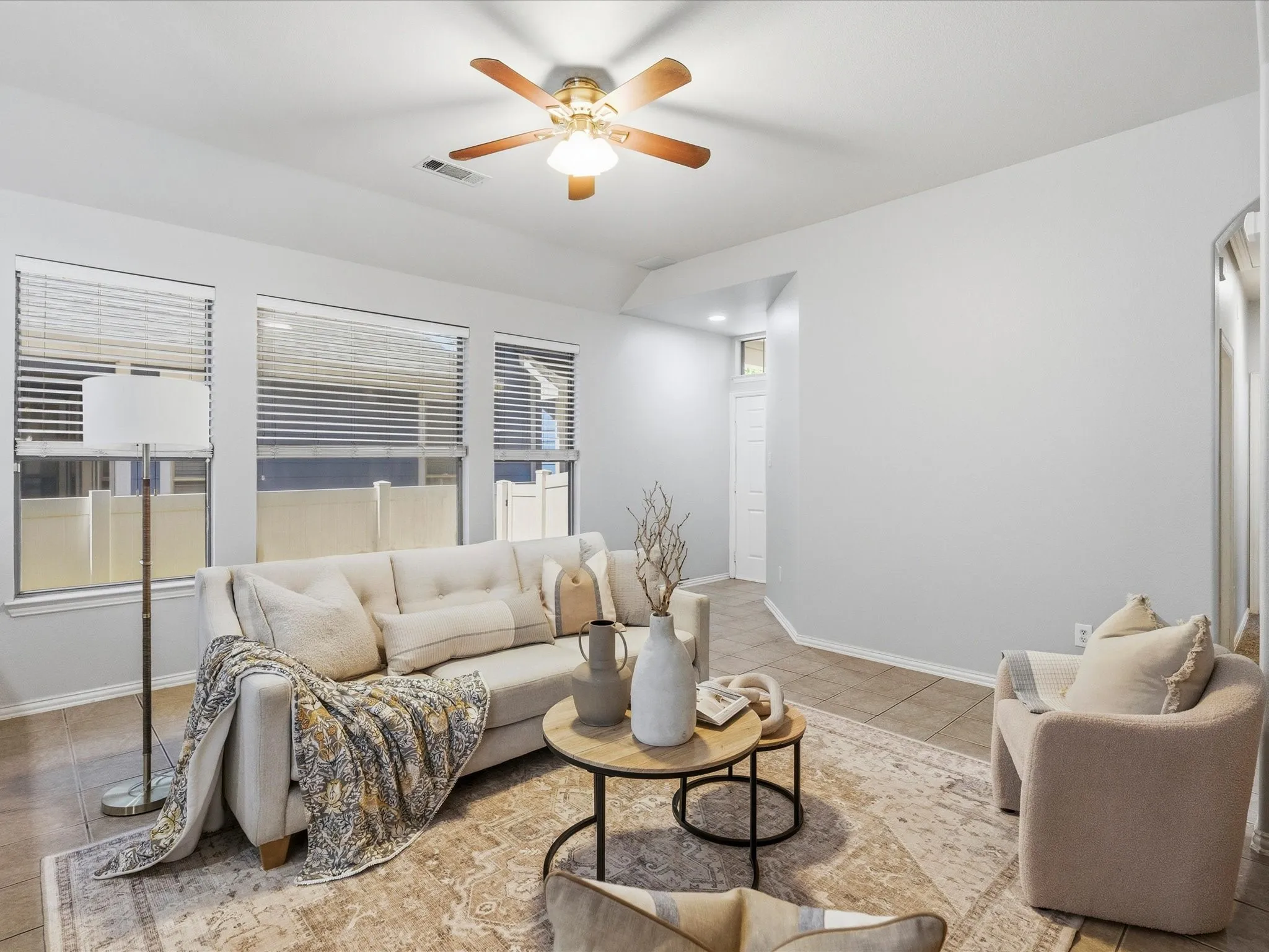 Spacious living room leads into separate dining and kitchen