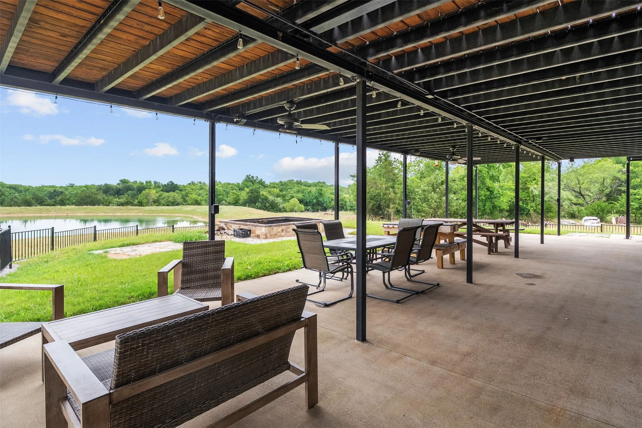 Relax in the shade in the 60 ft long covered porch!