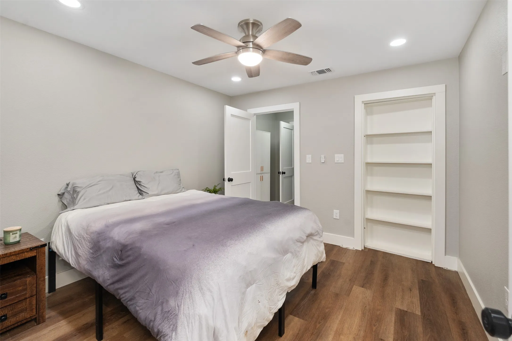 Downstairs ensuite bedroom with secret room-closet behind the bookshelves.