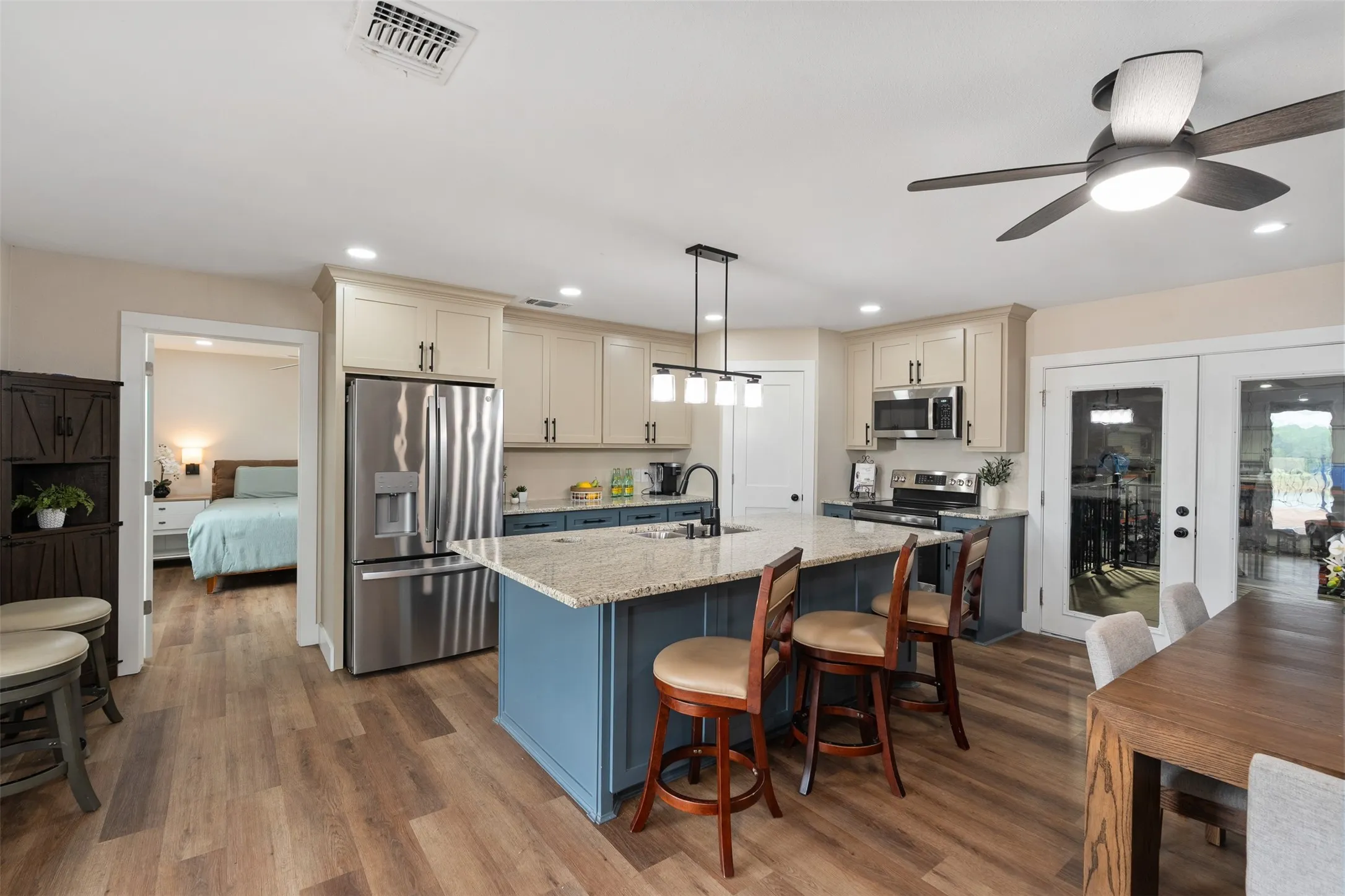 Beyond kitchen is an ensuite bedroom, through French doors is the shop interior. landing and stairs, as well as an elevator.