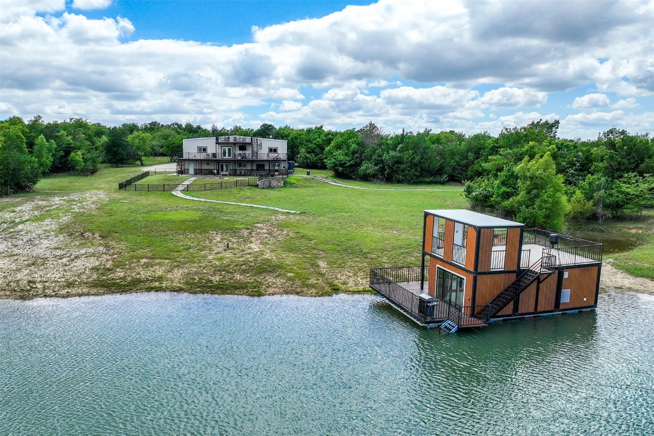 3 Acre Lake with custom built covered indoor-outdoor fishing pier on the water!