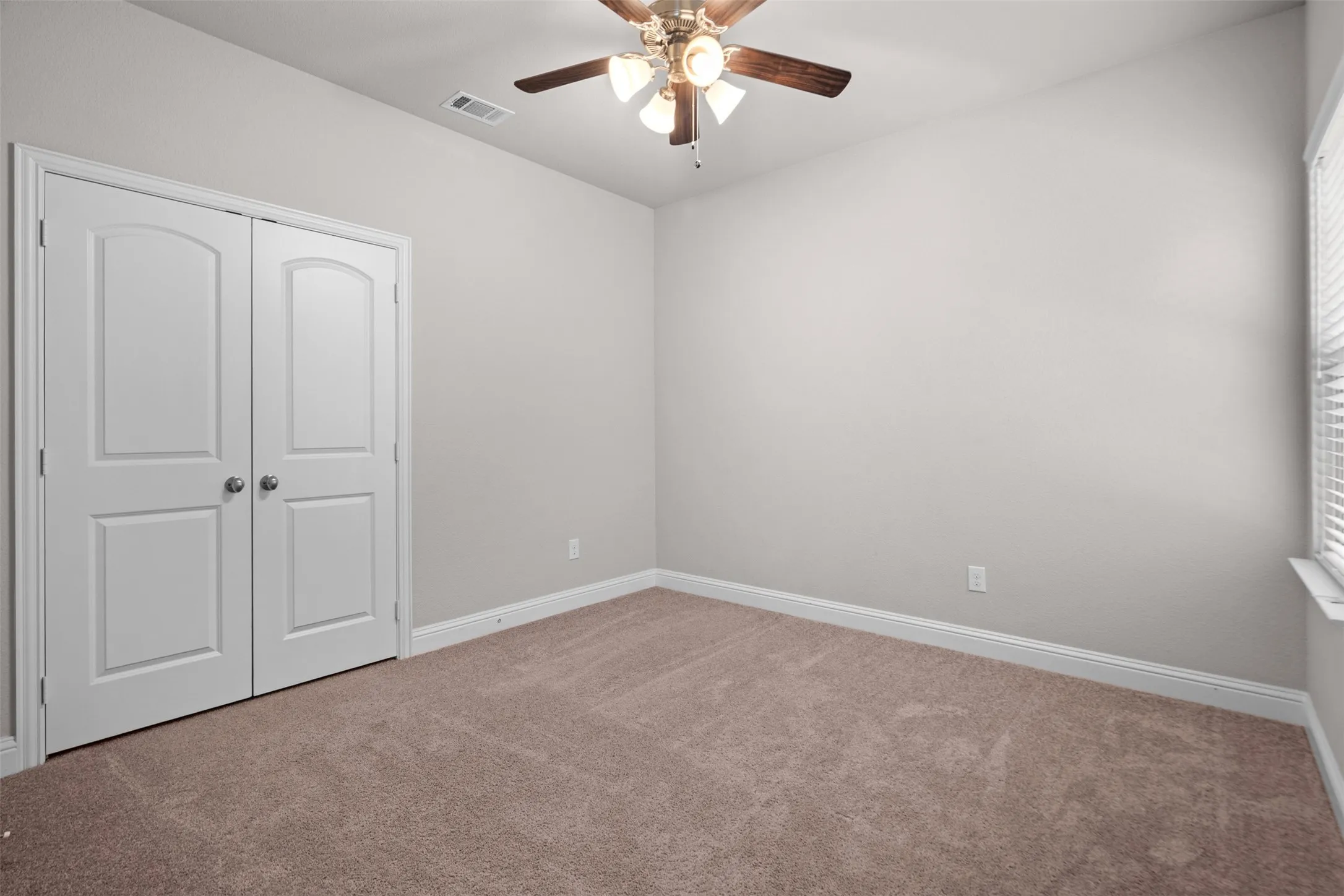 Neutral tone wall paint with matching baseboards