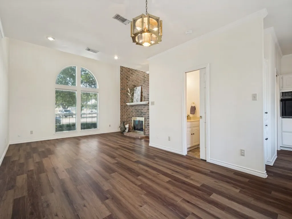 View from the dining area with funky vintage light fixture and guest accessible powder bath.
