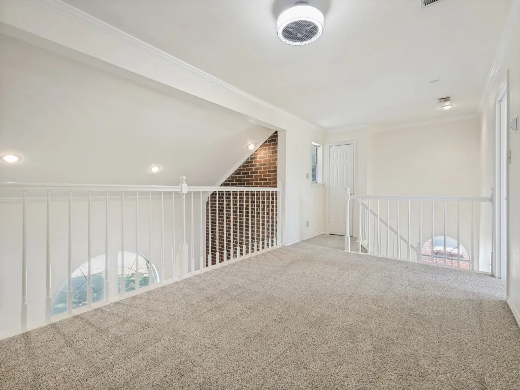 Upstairs flexible living space is great for lounging, working or exercise space.