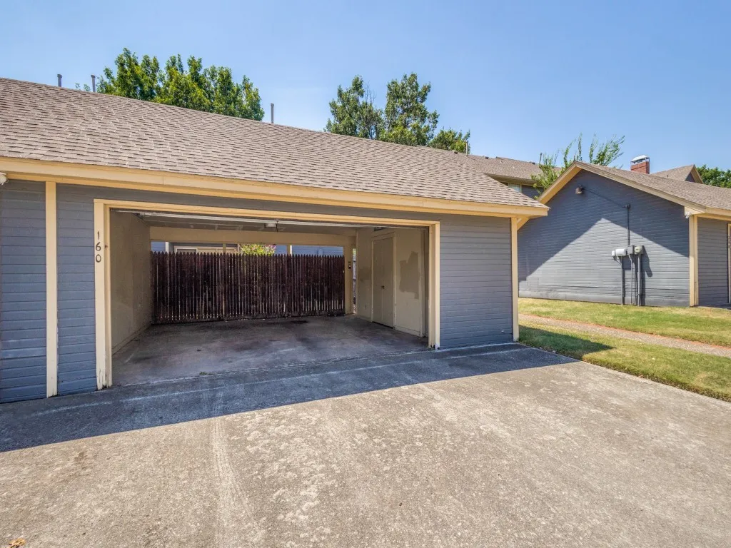 Nice 2 car garage with a storage cove and closet for storage.
