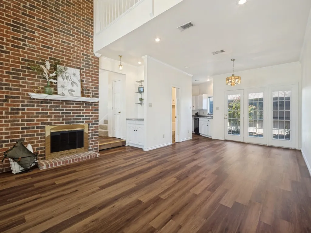 Comfortable living space with great entry drop cabinet, wood burning fireplace and open dining area with views to the patio.