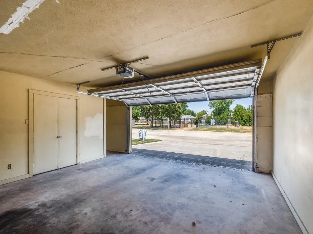 Another view of garage and view to the community pool which is just steps away.