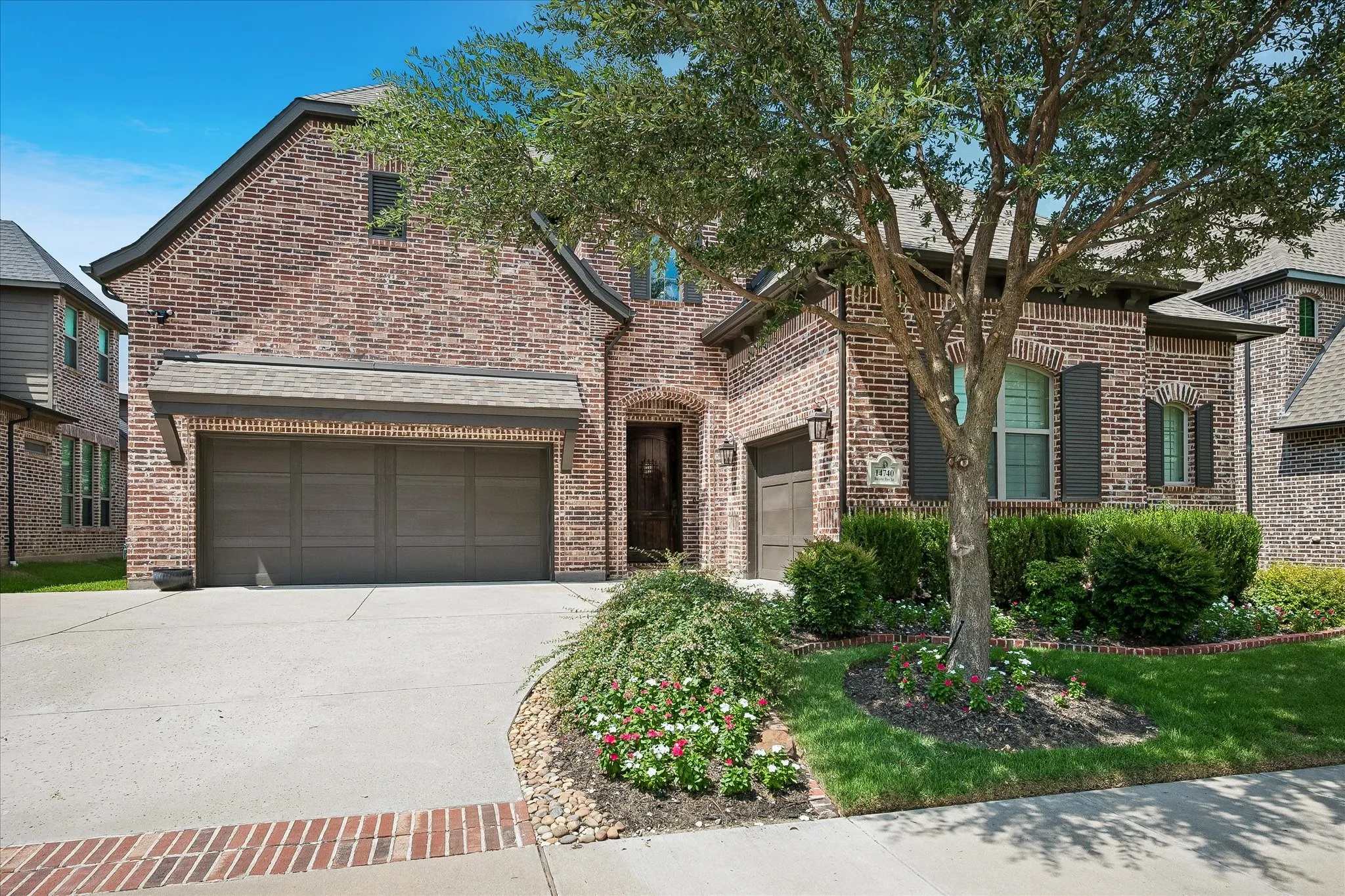 Brick exterior with multiple gables and dark window shutters