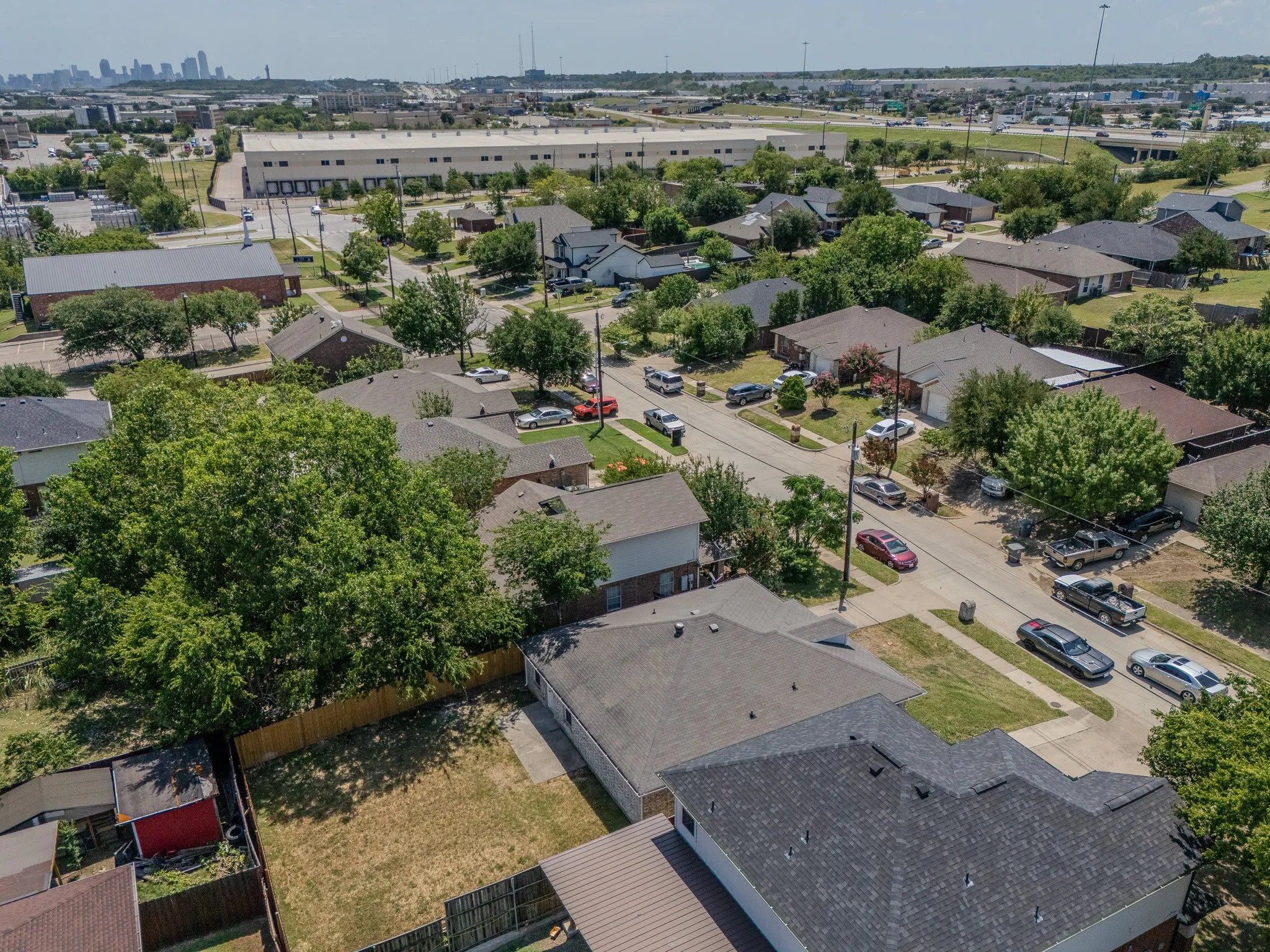 Aerial perspective showcasing a residential neighborhood with a mix of single-story and two-story homes