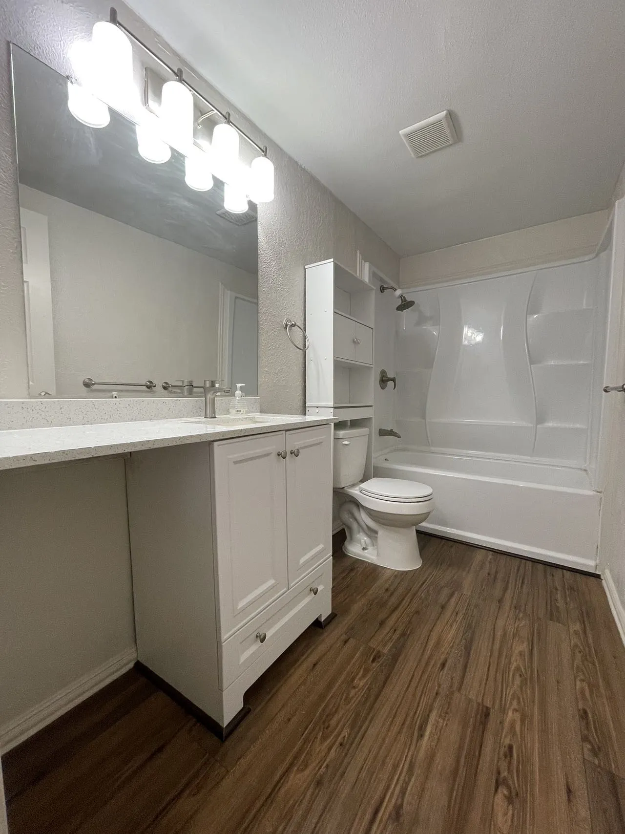 Wood-finish flooring throughout