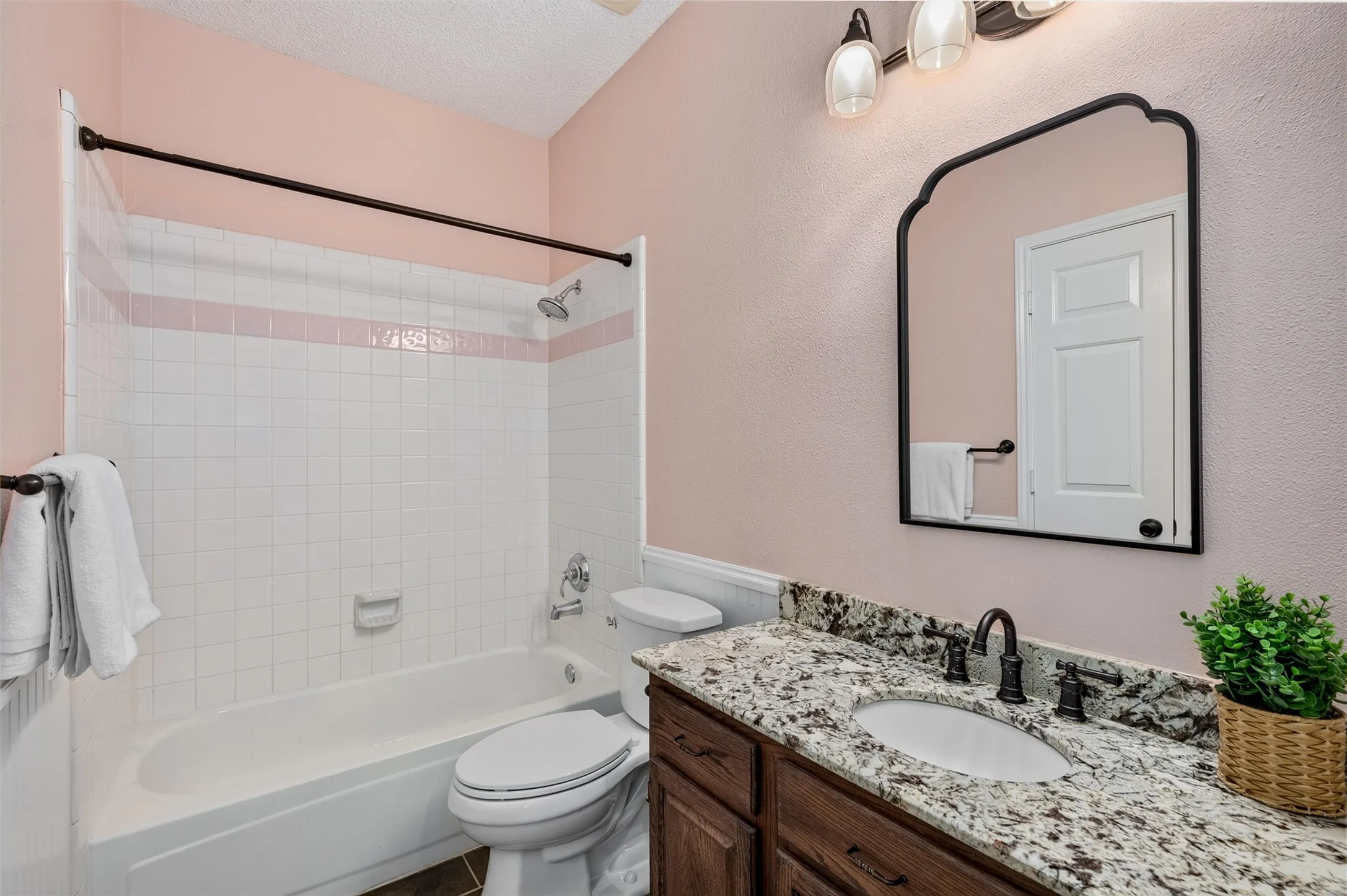 Retro is BACK! Walls painted to match the VINTAGE pink Tile in tub/shower