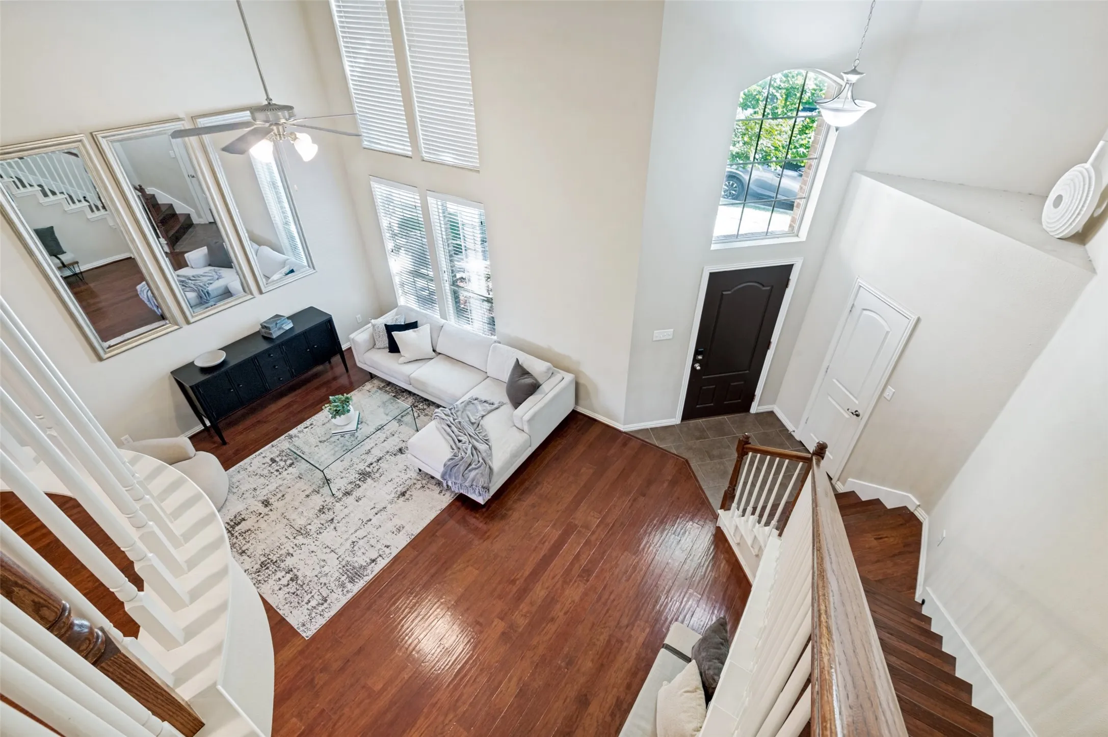 Second-floor overlook offers a striking view of the two-story living room below.