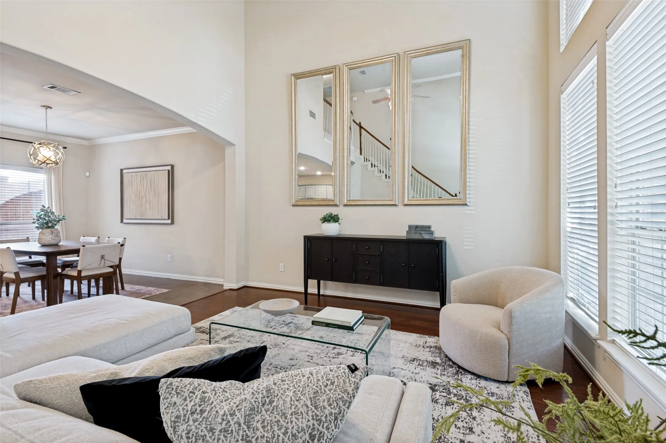High ceilings and large window in living room welcome plenty of natural light.