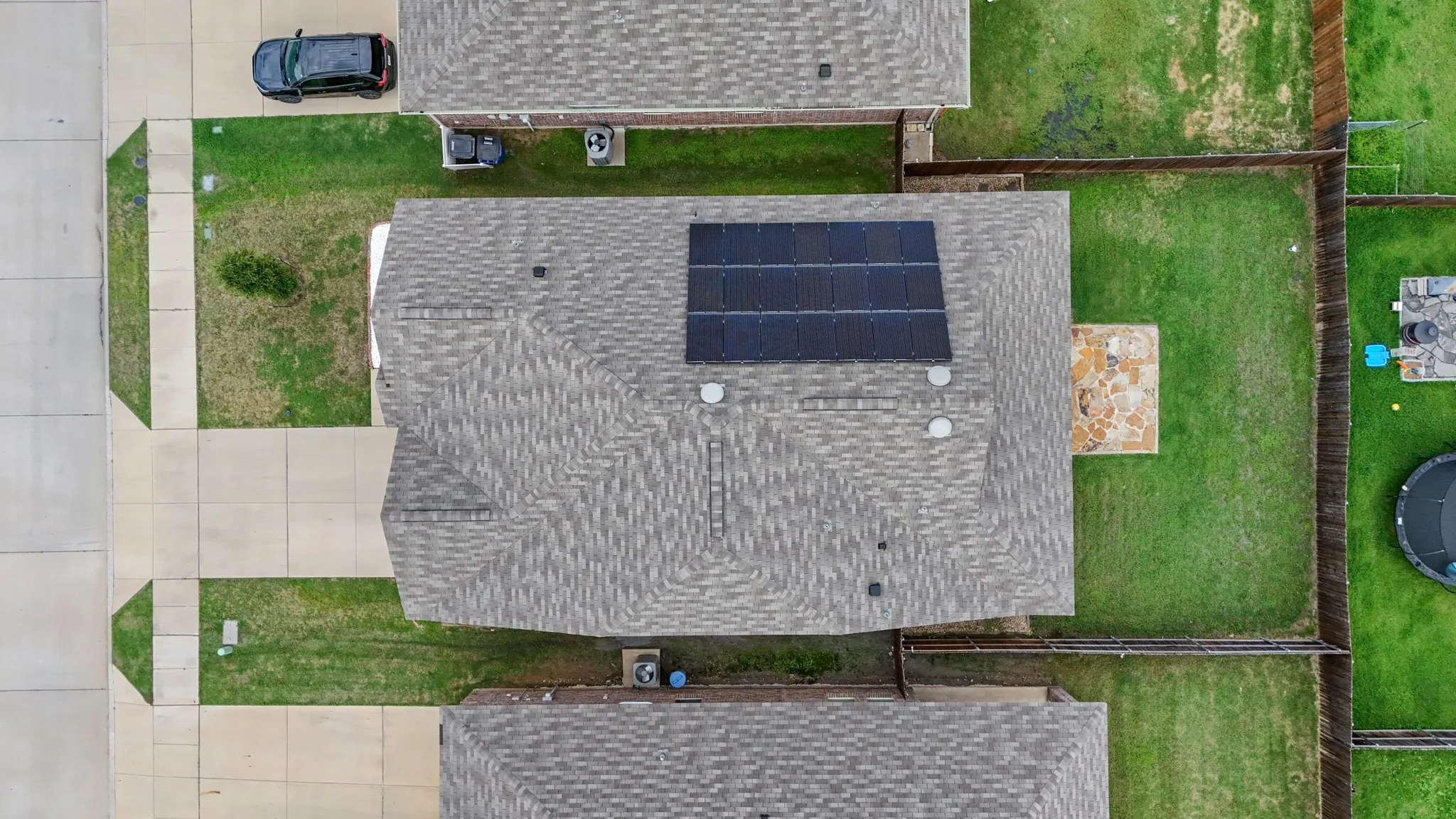 Gray shingle roofing with installed solar panels