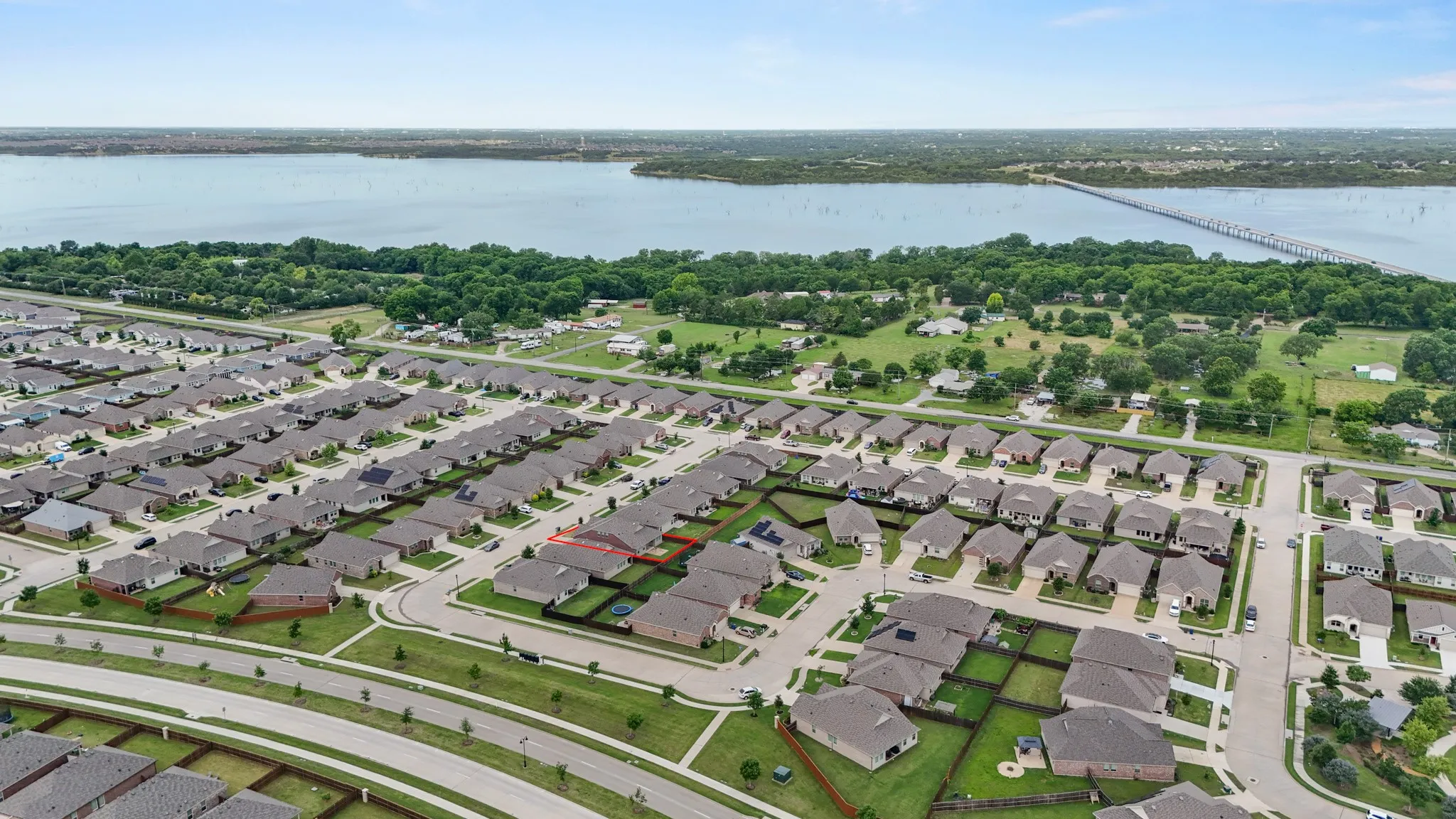 Expansive residential development featuring a structured street grid and consistent architectural styles