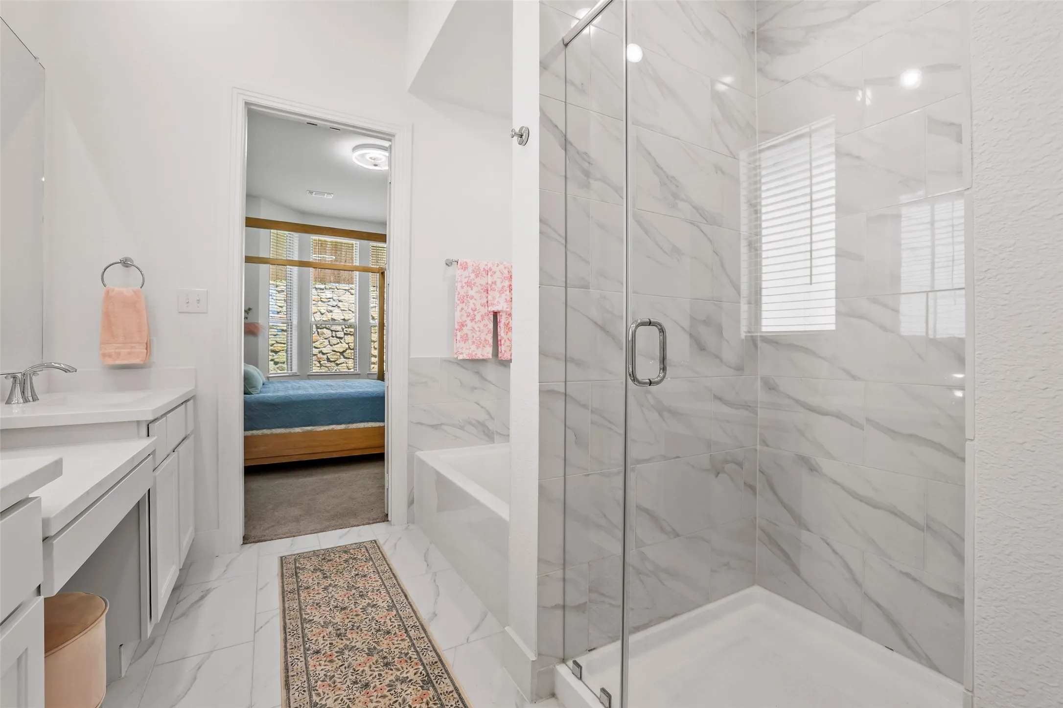 Primary bath is a true spa-like experience with upgraded tile finishes on the tub and shower