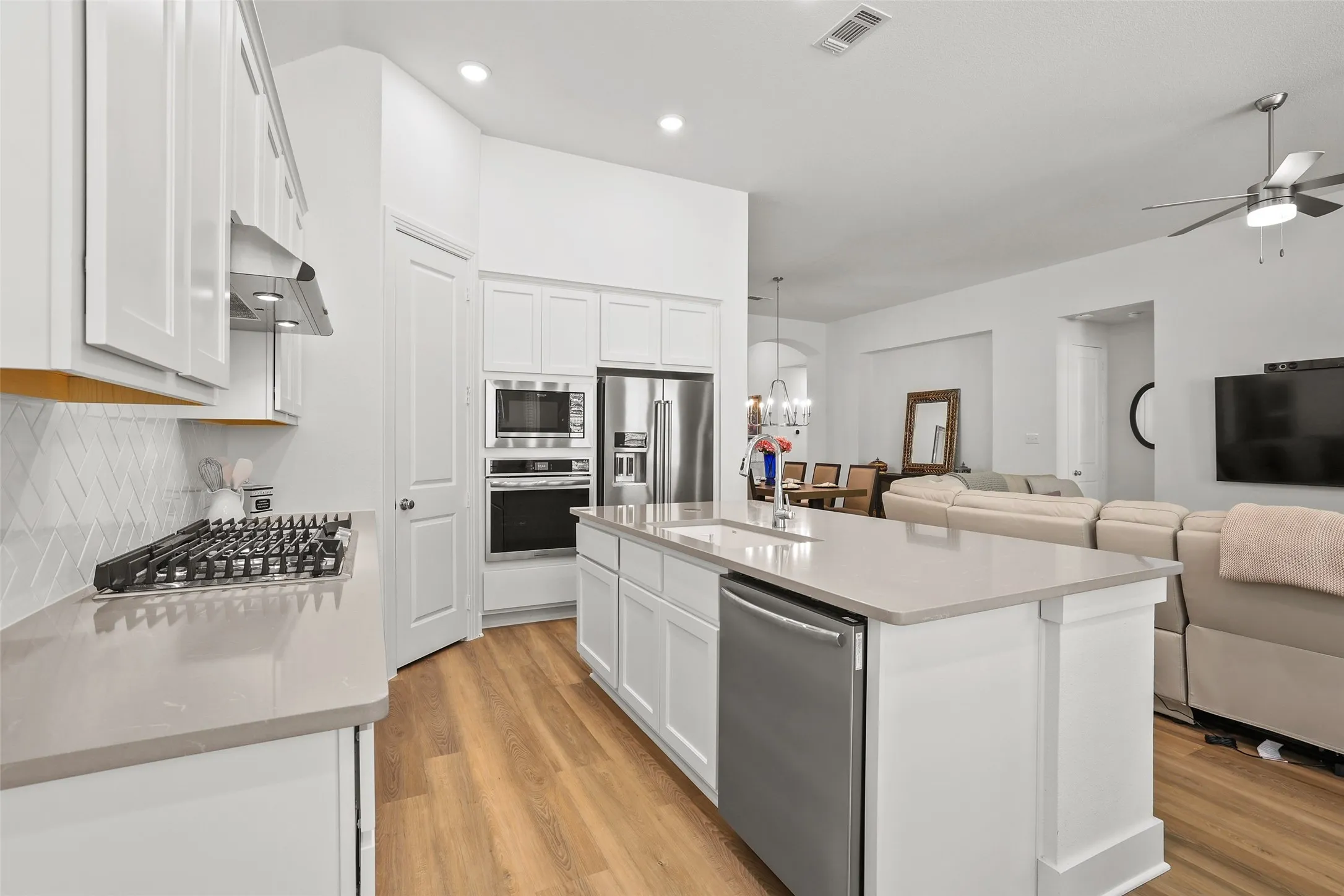 Kitchen is open to the living and dining areas