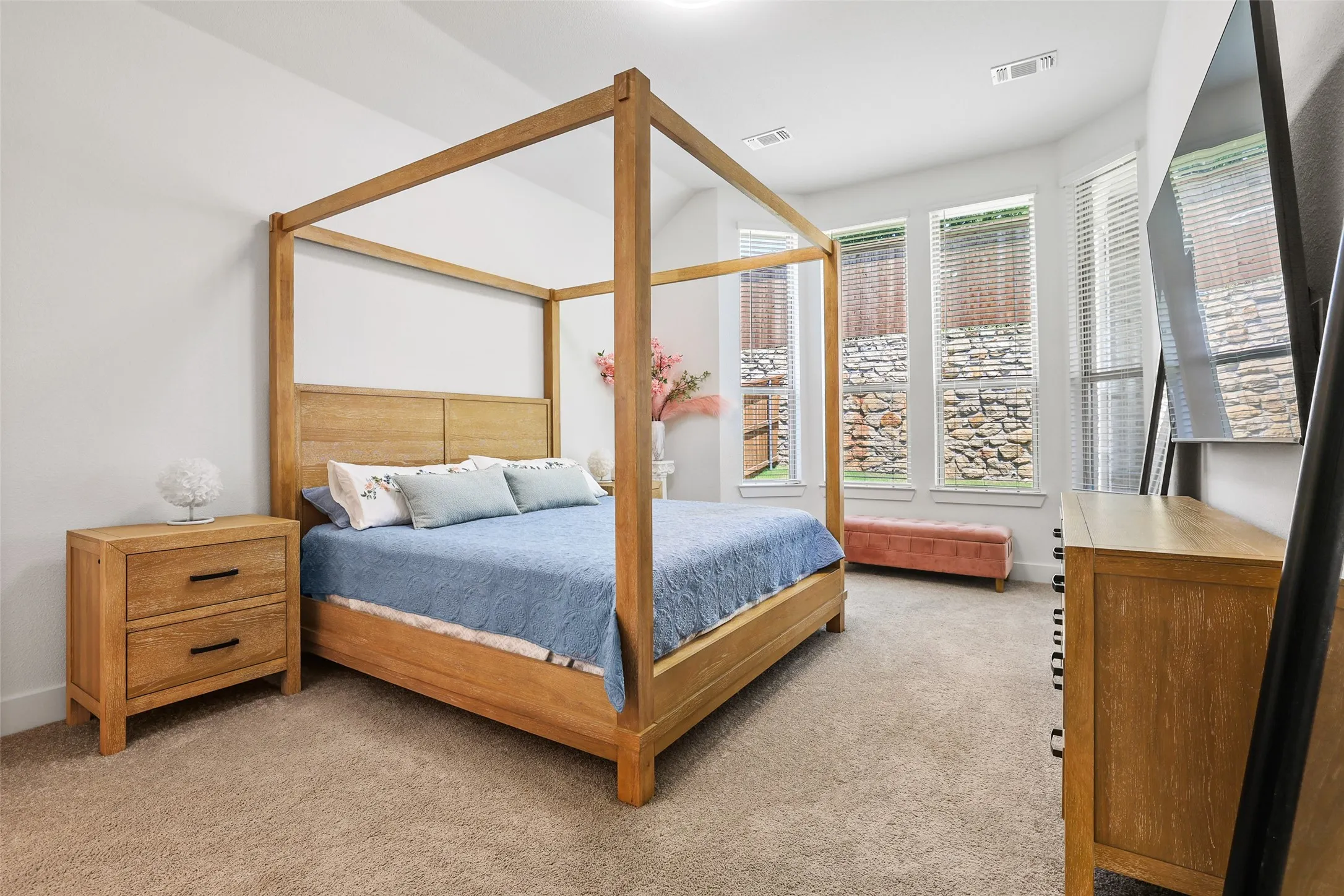 Oversized main primary suite with bay windows let the light in