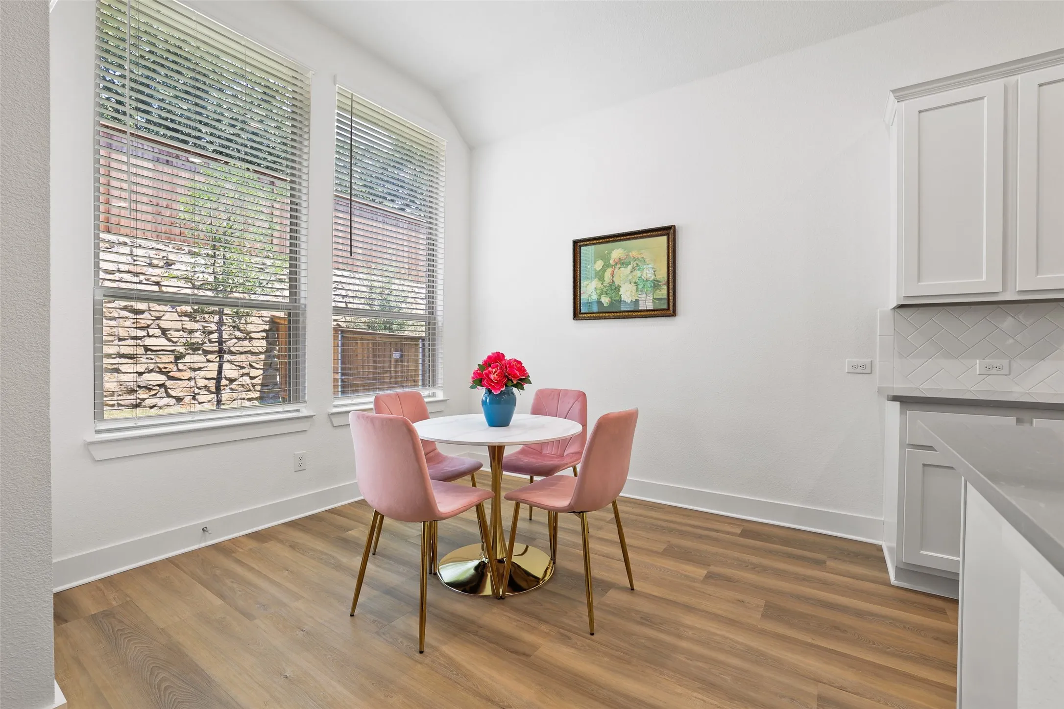 Large windows fill the kitchen and breakfast area with light