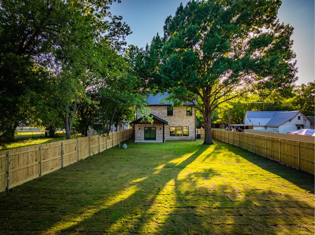large yard with privacy fence and room for a future pool