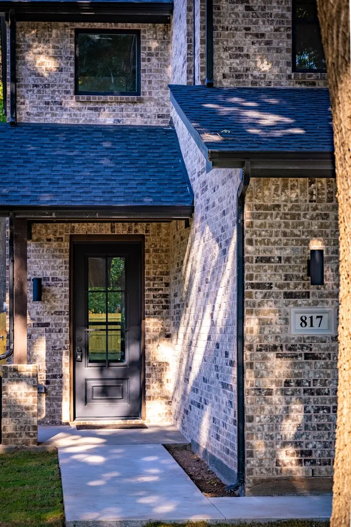 Welcoming iron front door with glass window