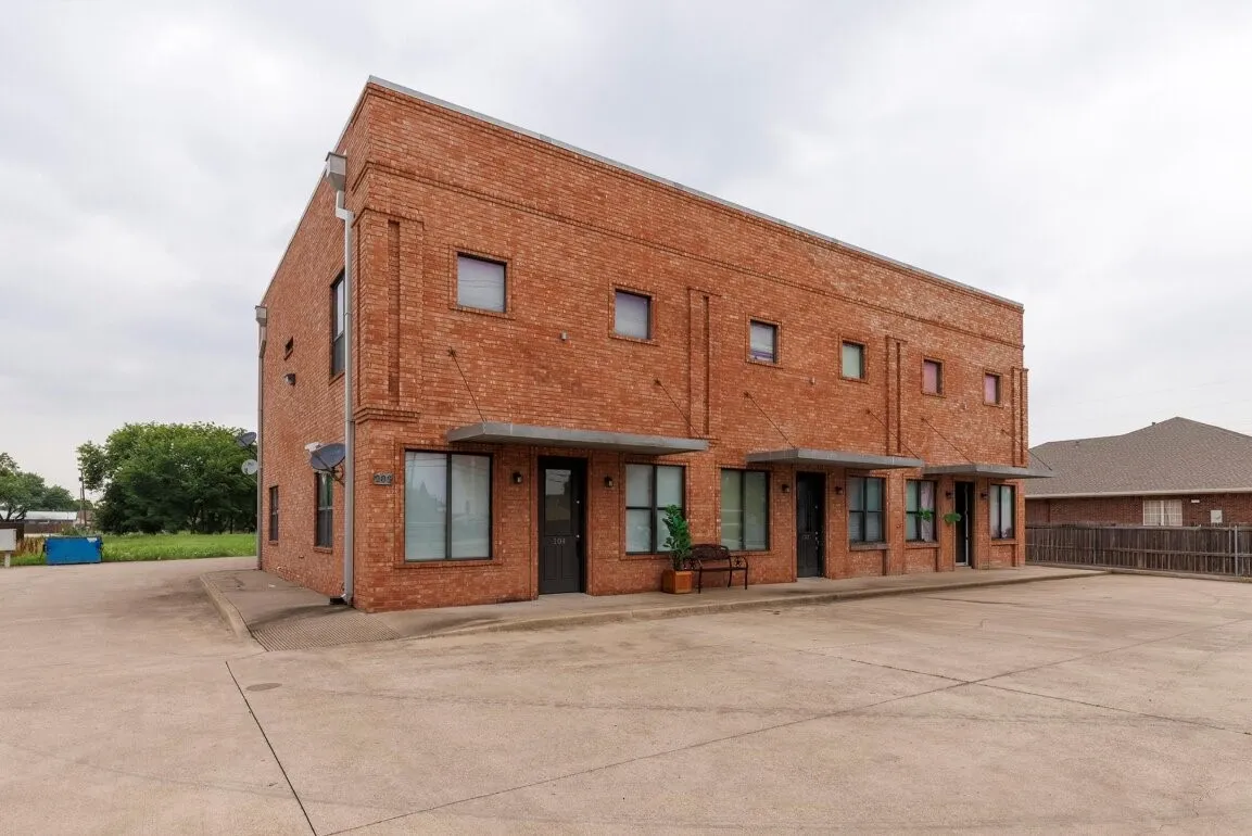 Brick exterior with multiple units, each featuring a dedicated entry