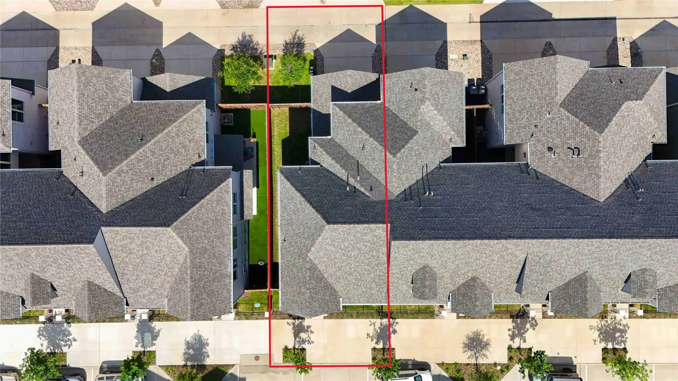 Expansive property lot featuring a manicured grass lawn and mature trees