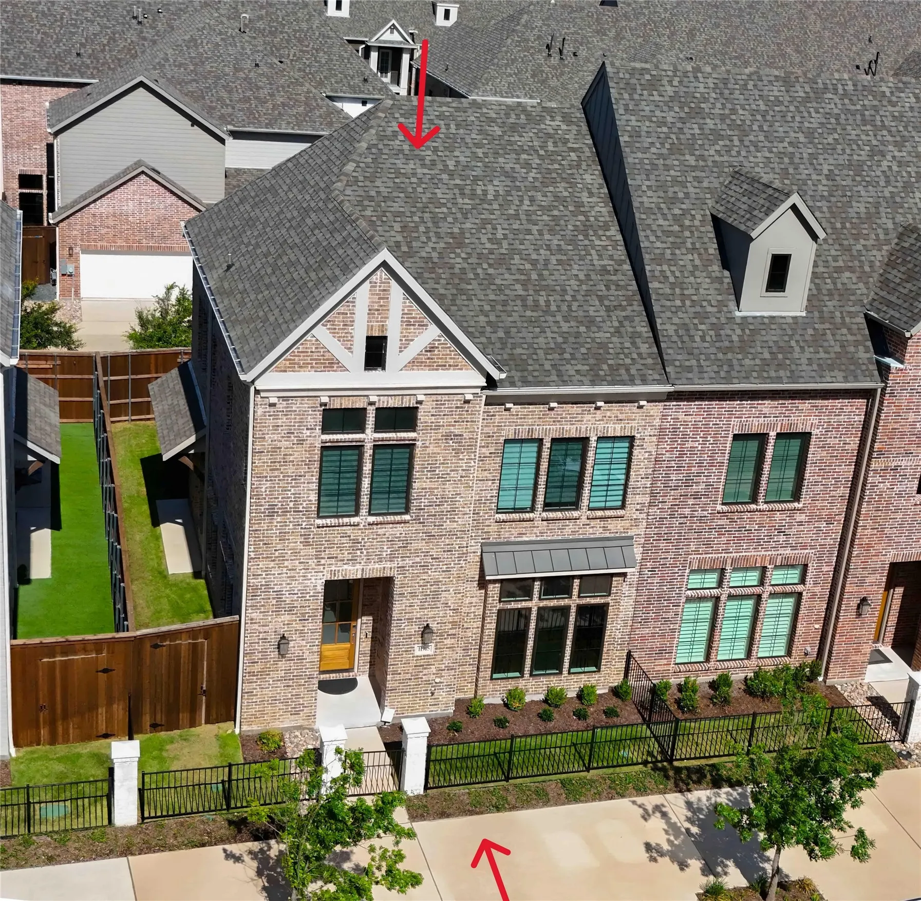 Brick exterior featuring a gabled roofline and dormer window