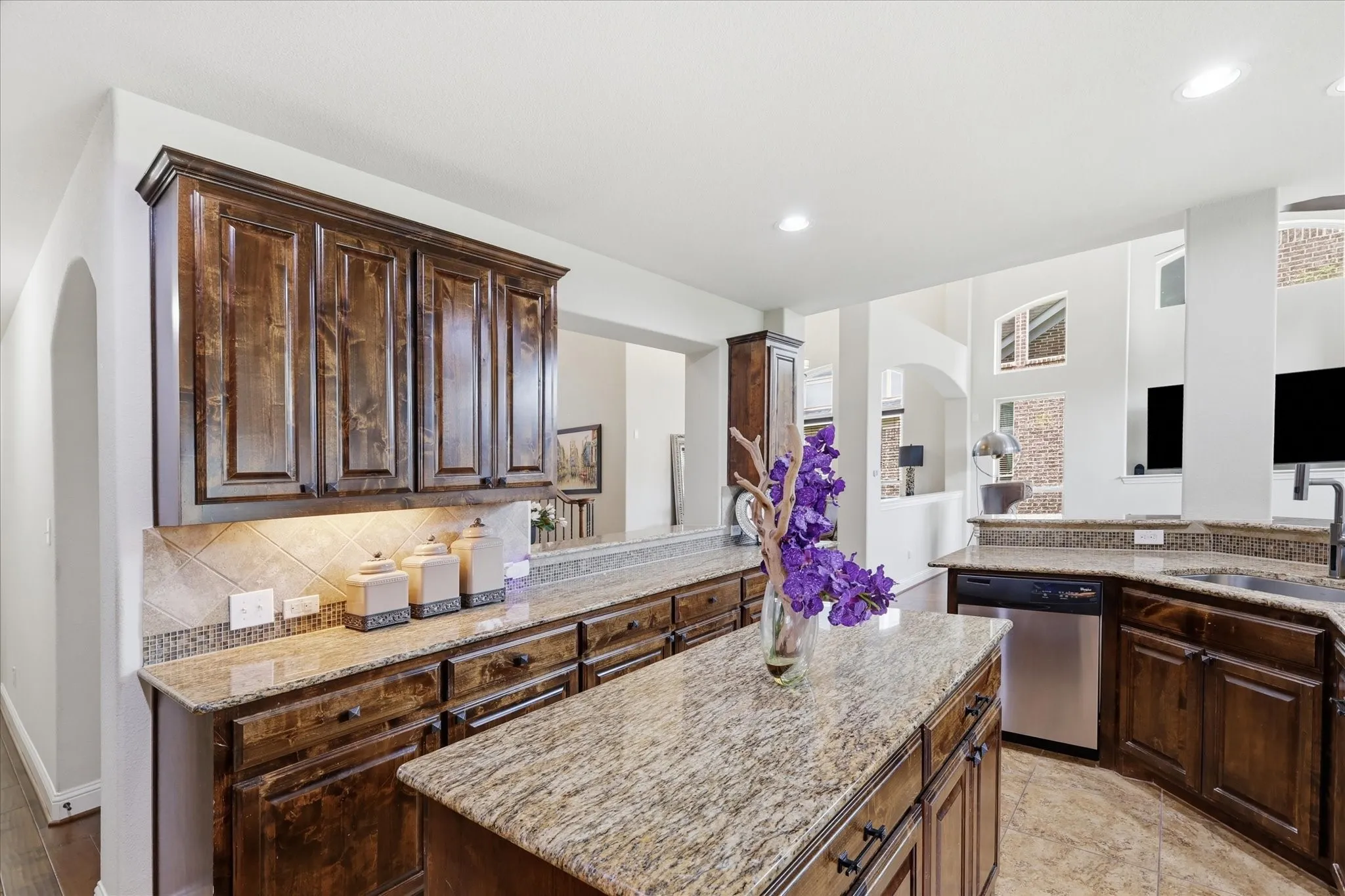 Under cabinet lighting and ample counter and cabinet space makes this kitchen a chef's dream.