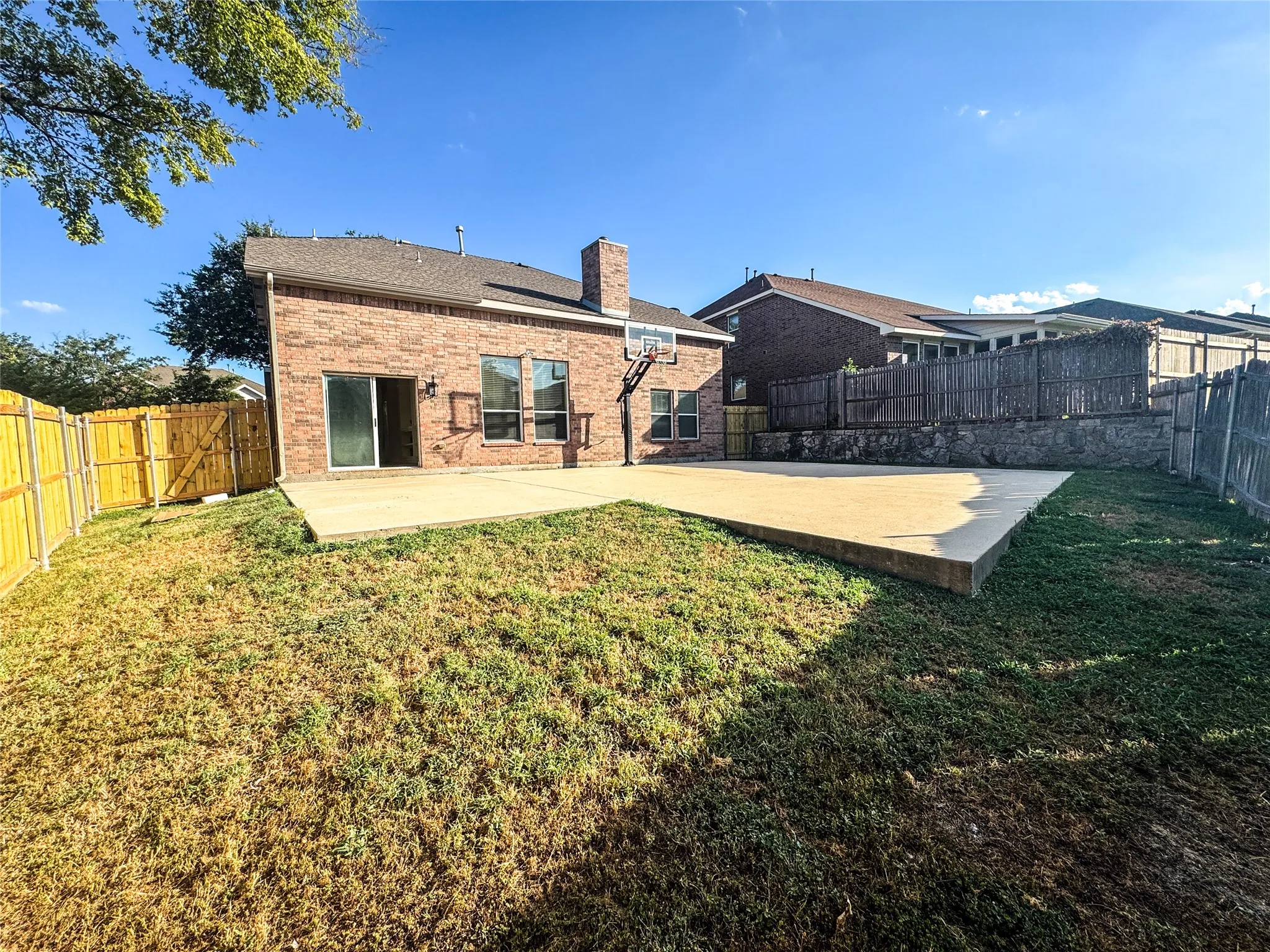 Expansive concrete patio offering generous outdoor living space