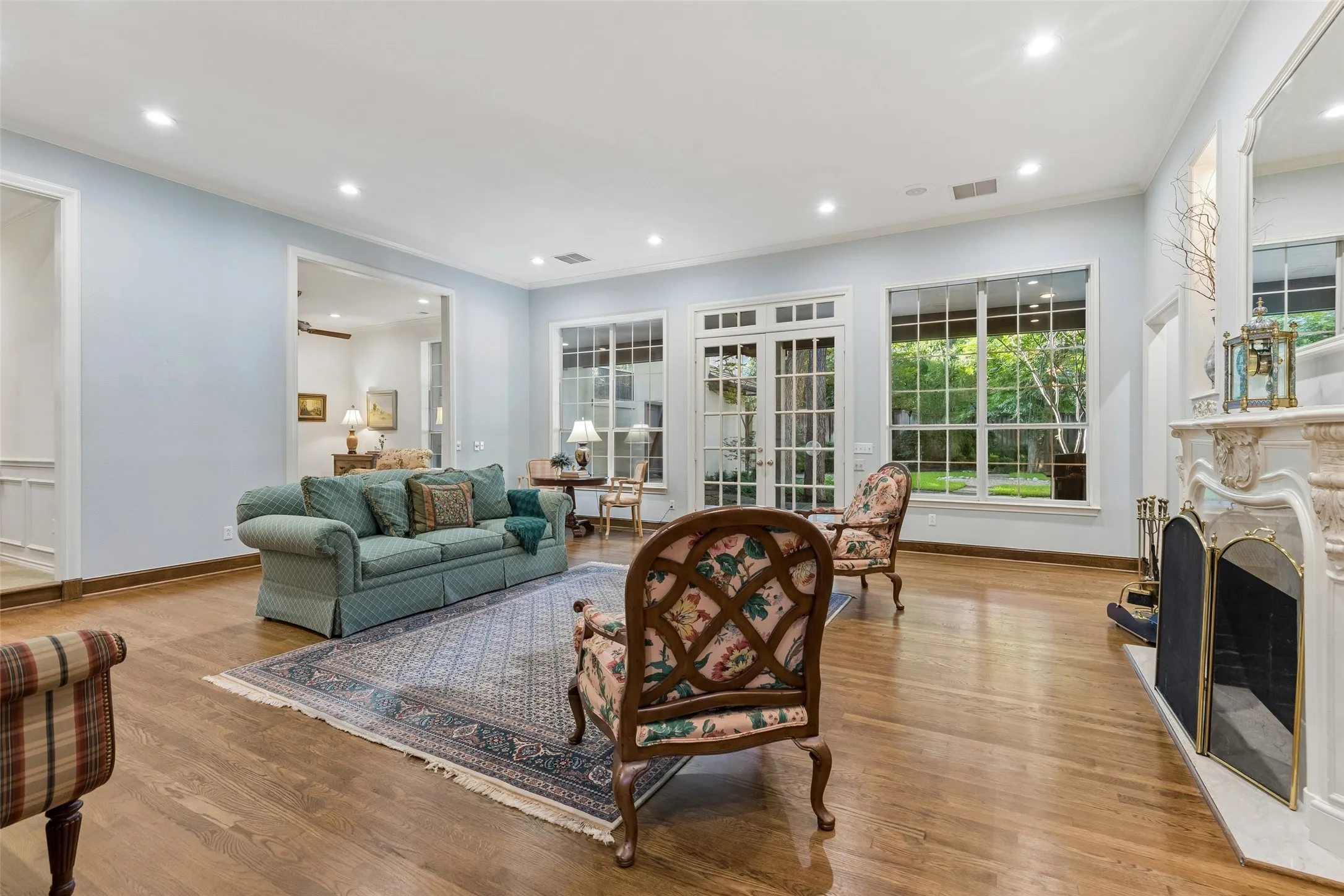 French doors in the Living Room open to breath taking views of the backyard.