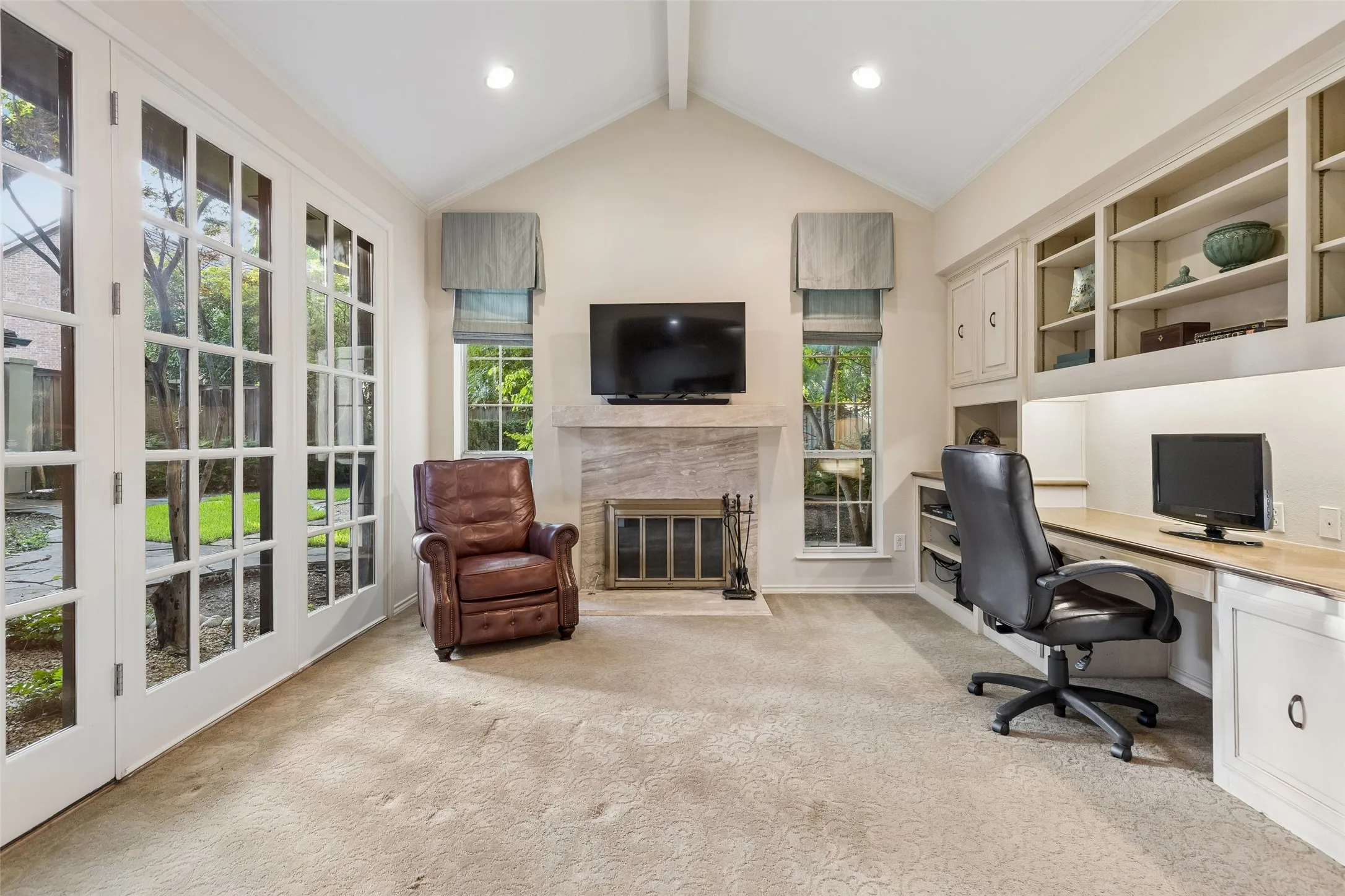 What an amazing office!  Built-in cabinetry, granite desktop surfaces, fireplace and lots of windows for natural light!