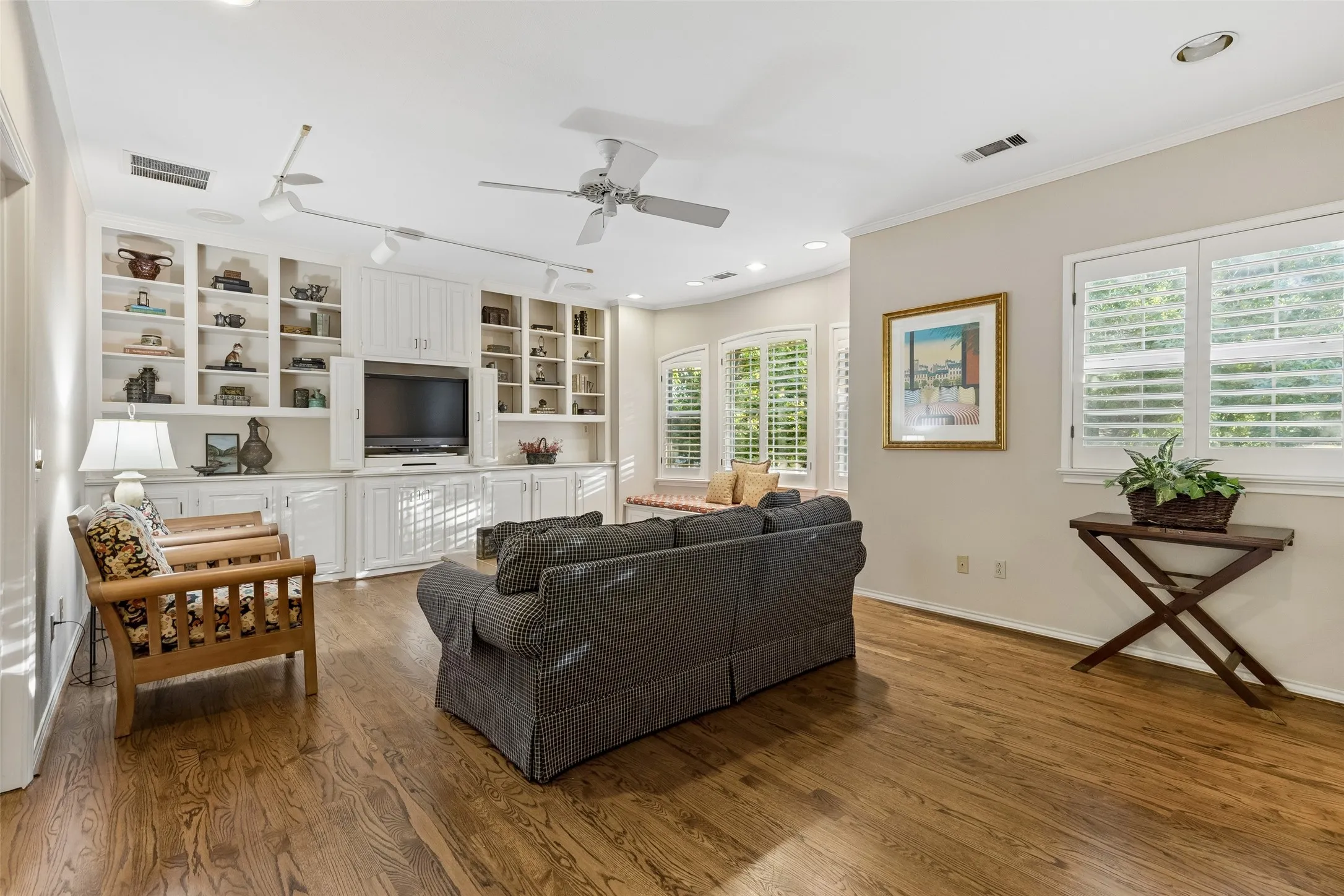 Game Room upstairs features a wall of built-ins, hardwoods, recessed lighting, Ceiling Fan plus a window seat.  It's also perfect for a Media Room:  your choice.