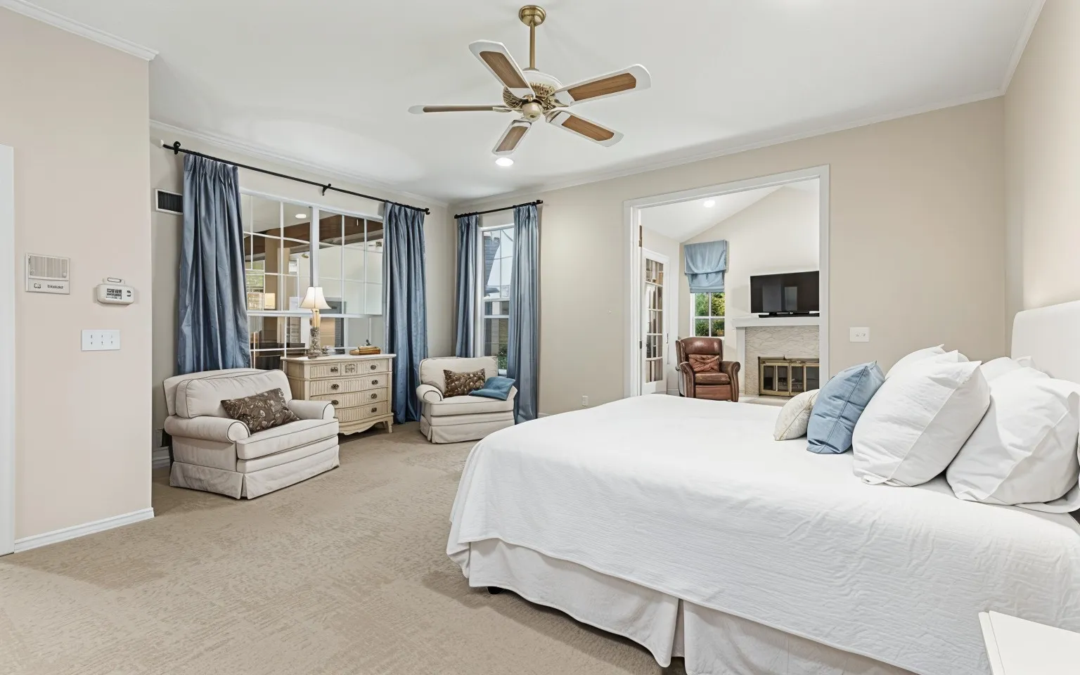 Relax and enjoy the Primary Bedroom with the bonus of a sitting area.  Study with Fireplace opens to Primary suite.