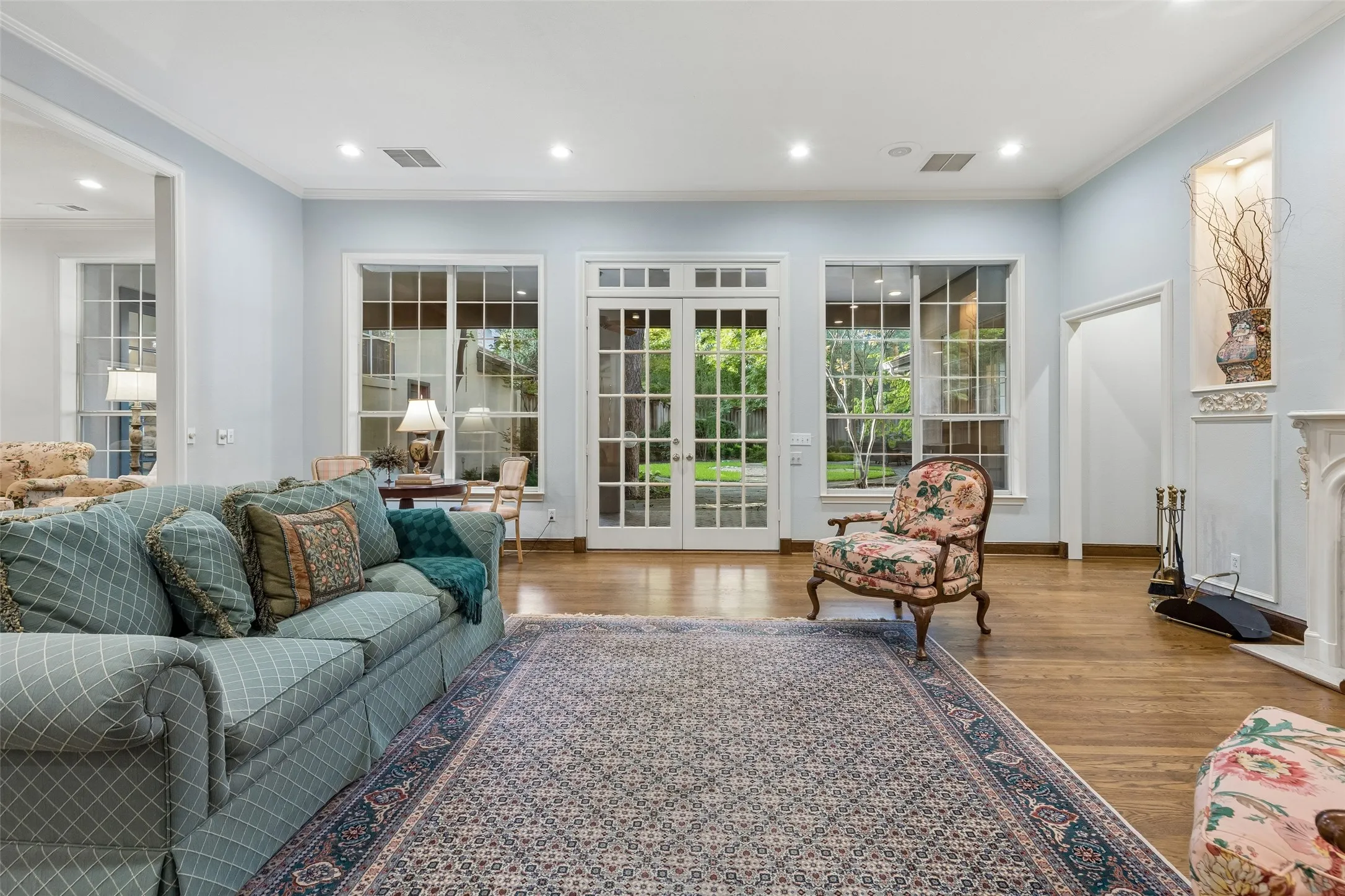 French Doors in the Living Room provide easy access to expansive landscaped backyard.