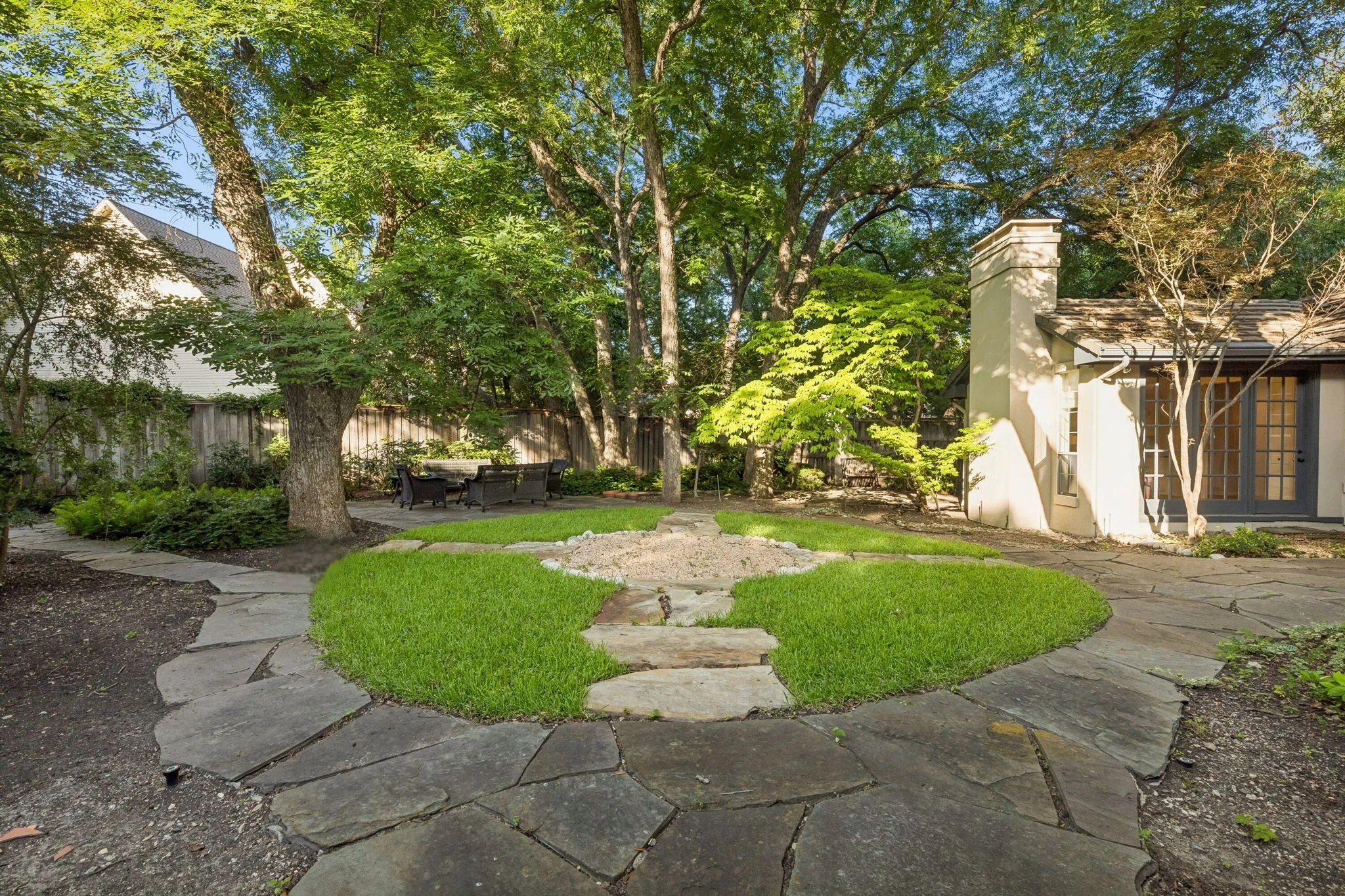 Backyard features extensive low maintenance grounds, professionally landscaped.  What a great place to escape from the world!