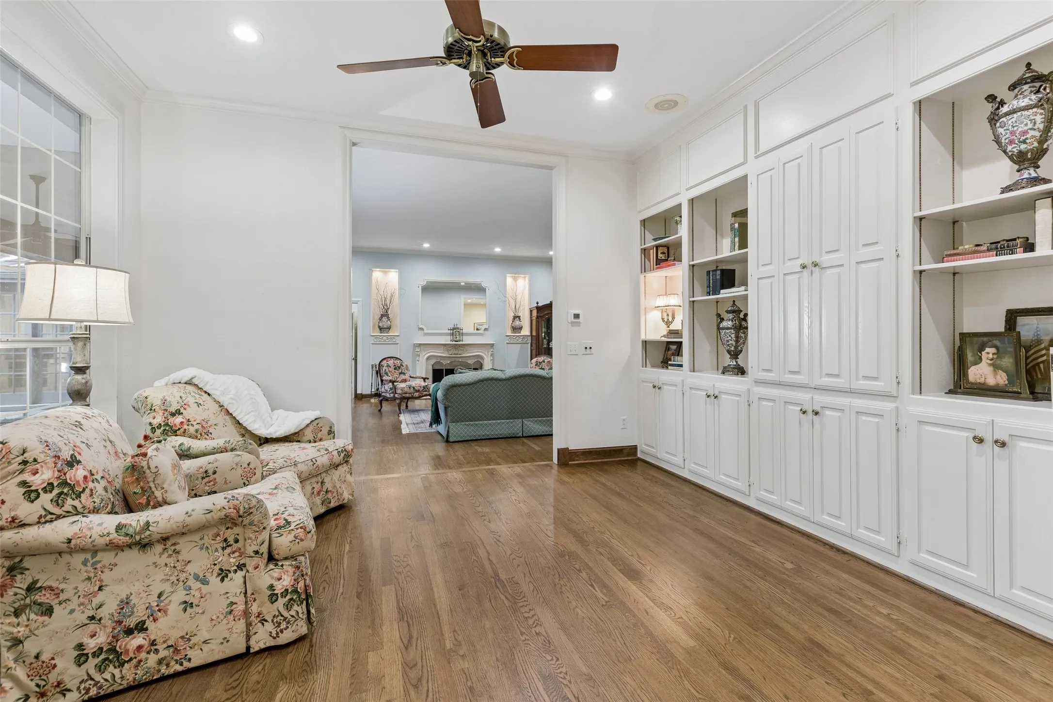 Wonderful built-ins plus TV cabinet enhance the Library, adjacent to the Living Room.