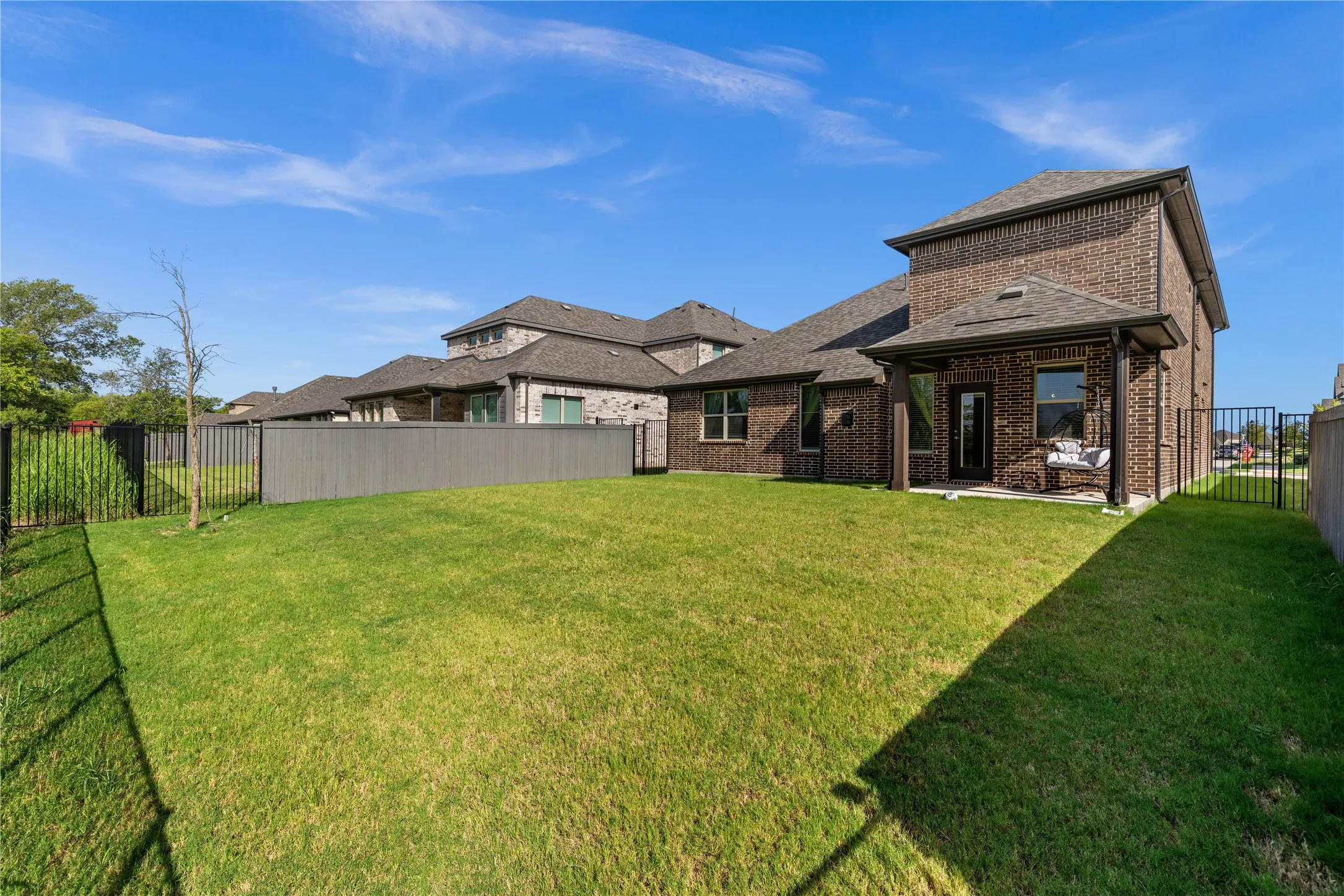 Private backyard with greenbelt views, lush lawn, and plenty of space for entertaining, pets, play, or future pool. Enjoy peaceful outdoor living from extended covered patio.