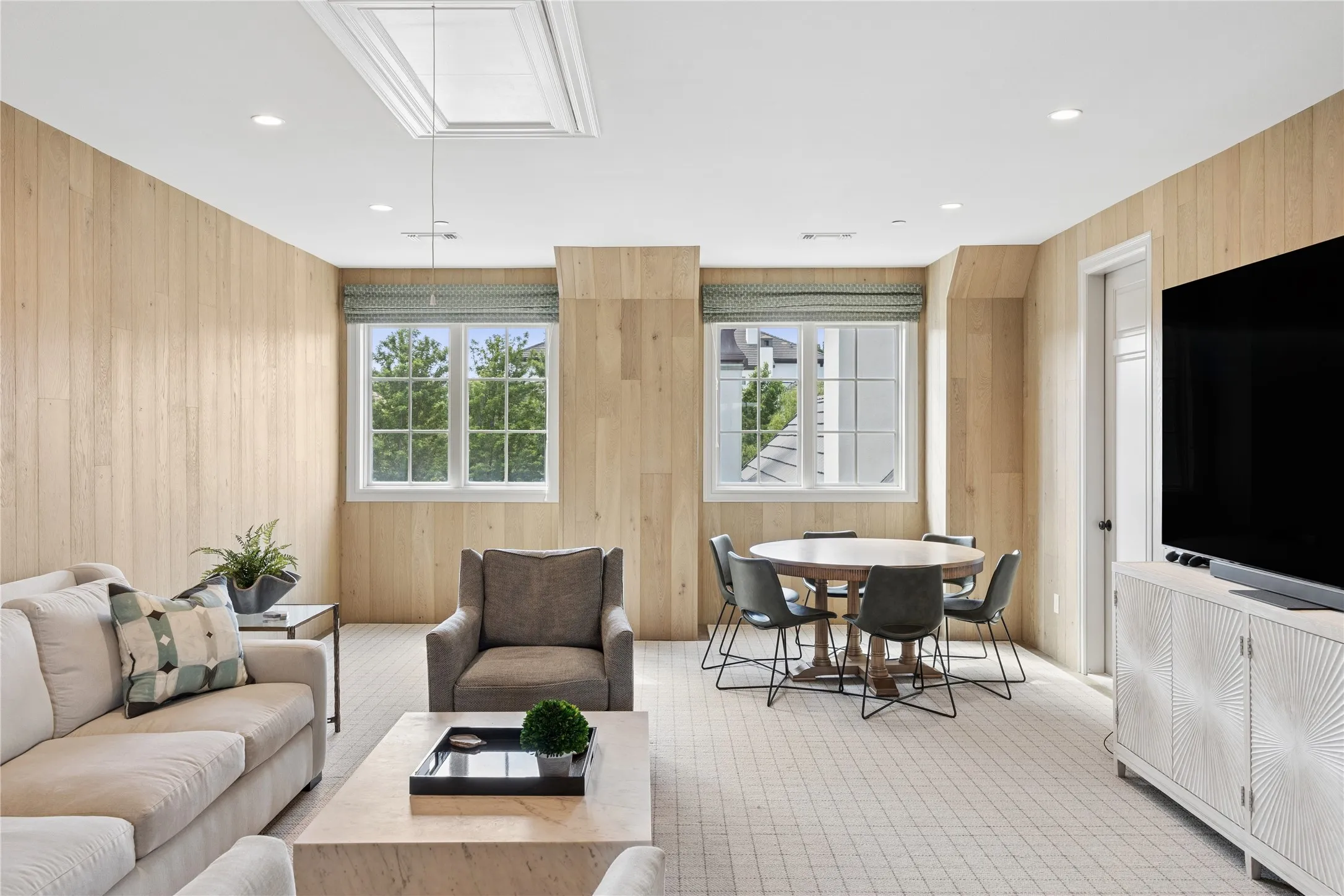 Upstairs additional flex space clad with white oak paneling