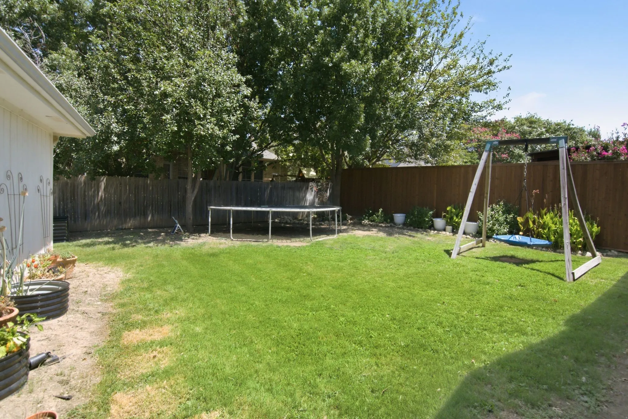 Large backyard grass area