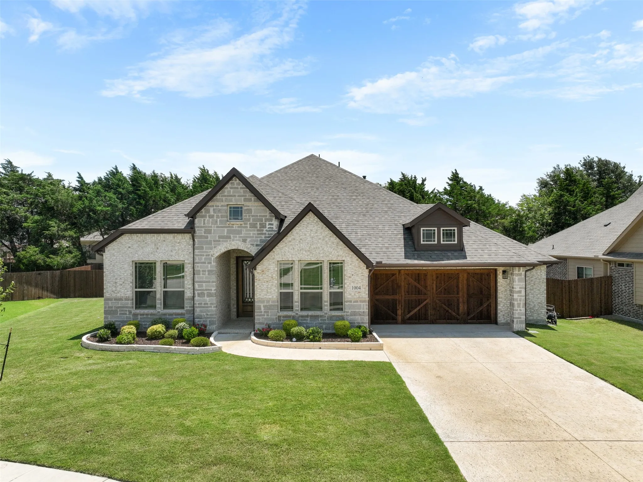 Stone and brick exterior with dark trim accents