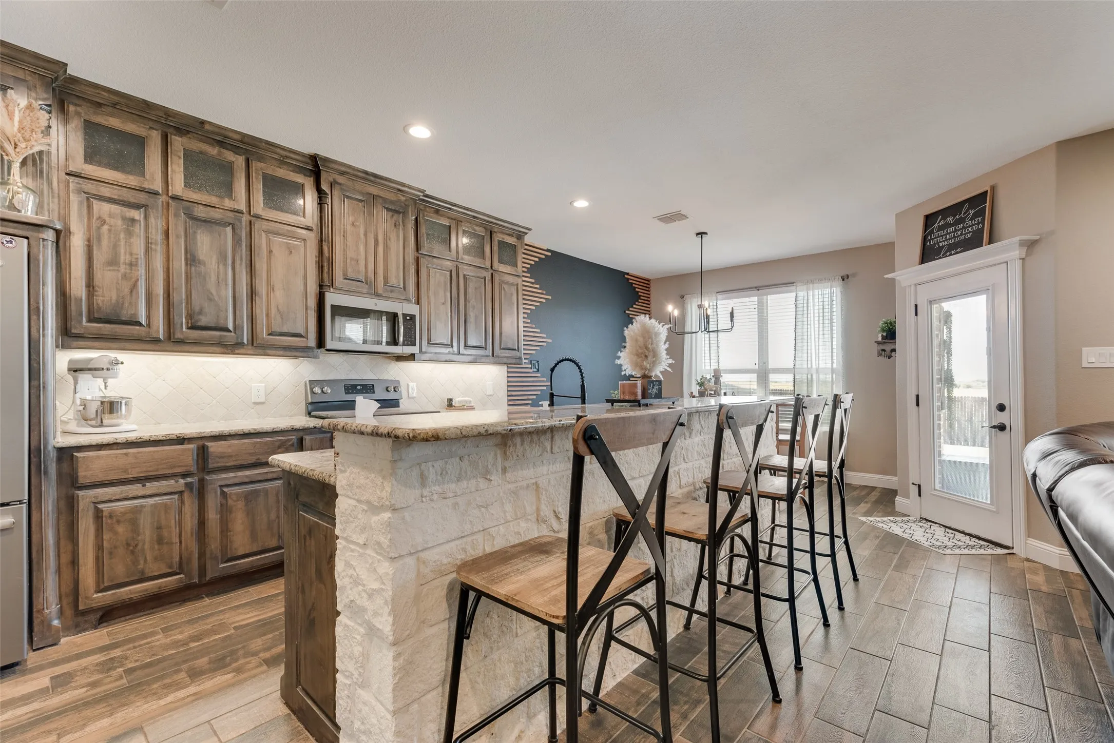 Kitchen featuring wood-finish cabinetry and tile flooring