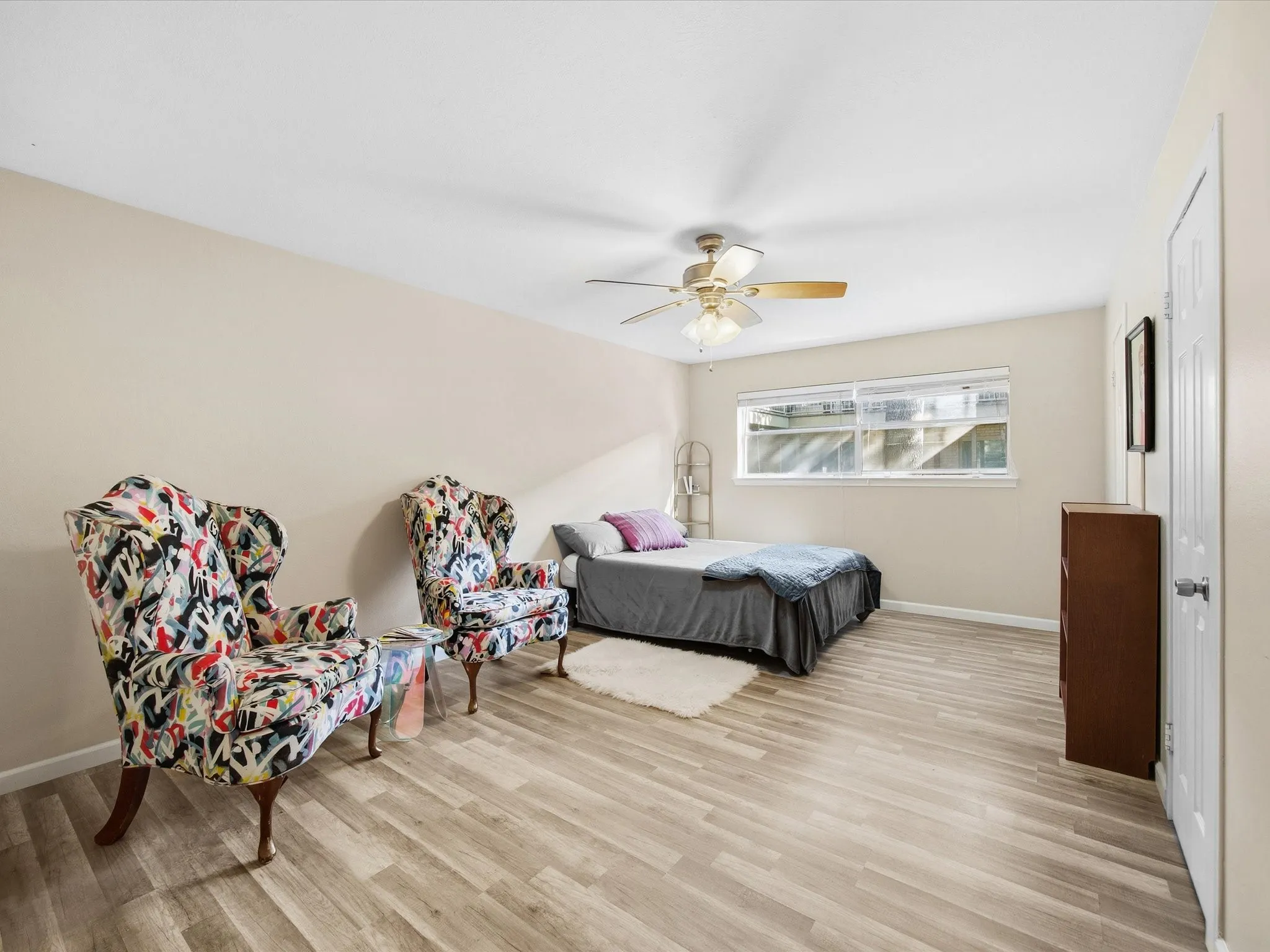 Primary Bedroom featuring light wood-style floors and a ceiling fan