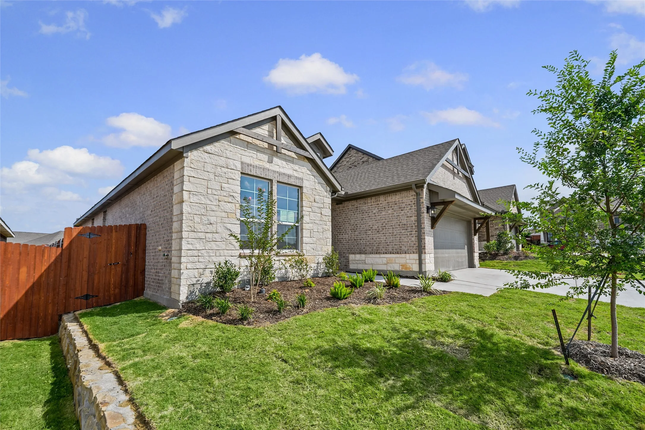 Stone and brick exterior with a gabled roofline