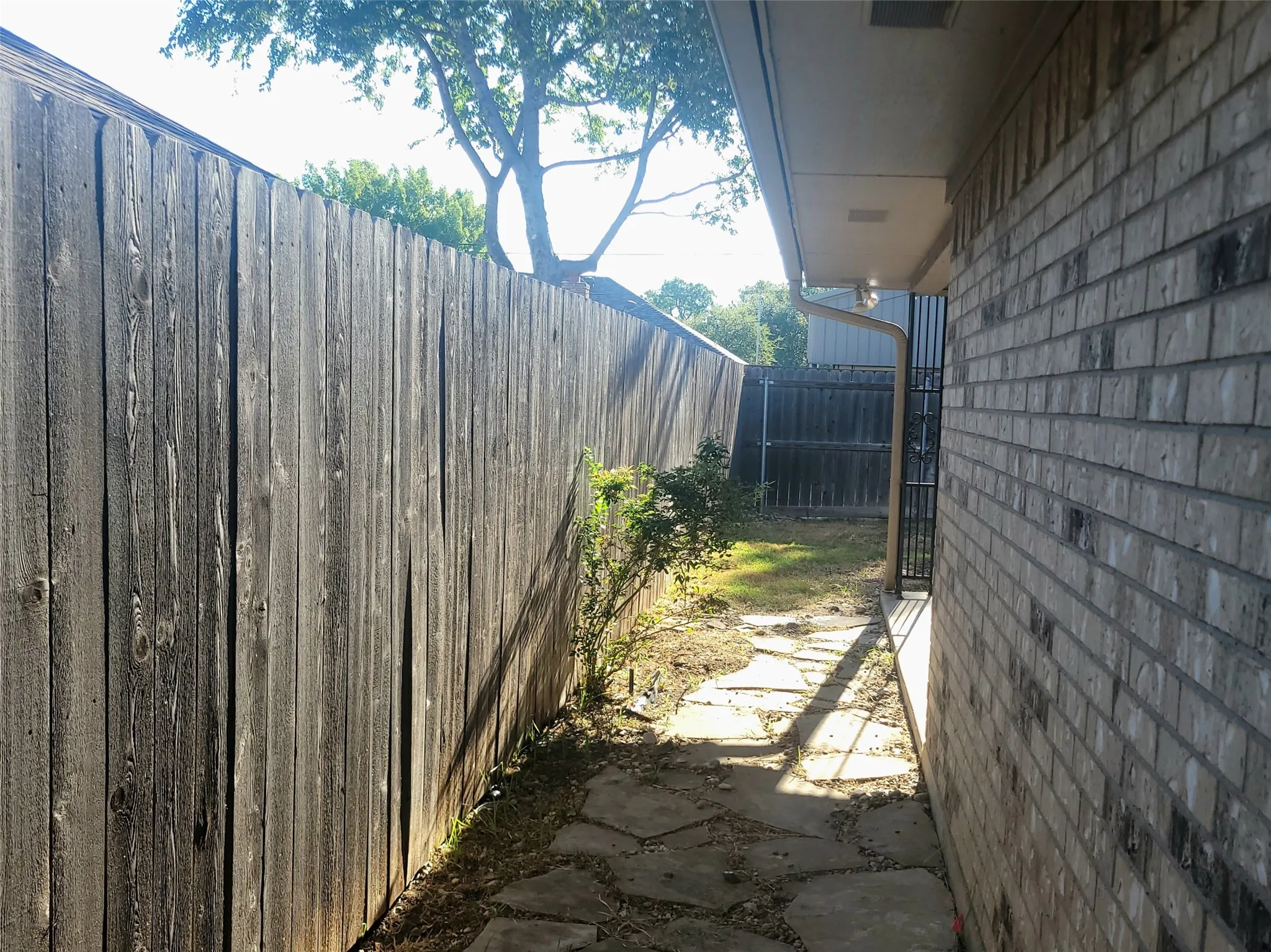 Walk way between patios in backyard