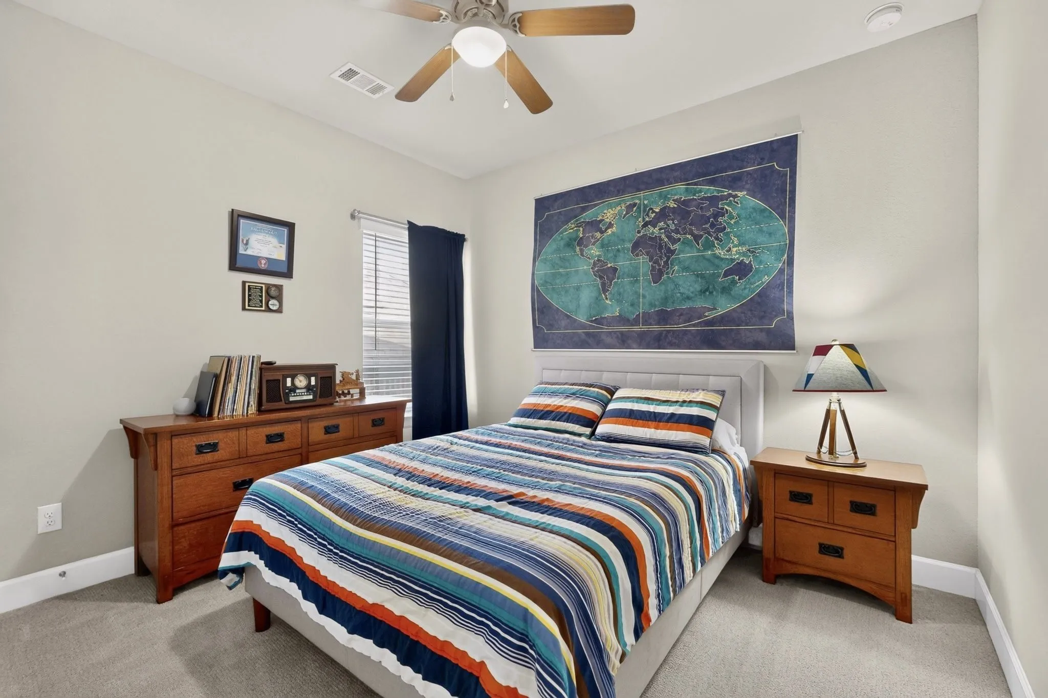 Neutral tone wall paint, light-colored carpet flooring, recessed lighting, and a ceiling fan with light fixture