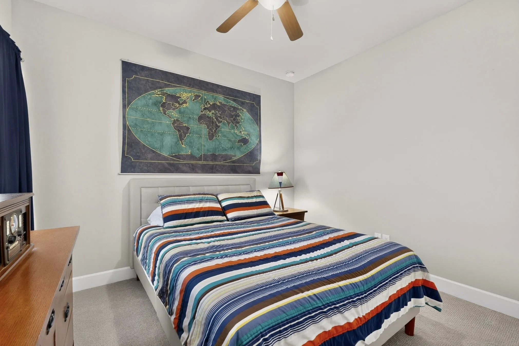 Neutral wall paint throughout a room featuring light gray carpeting
