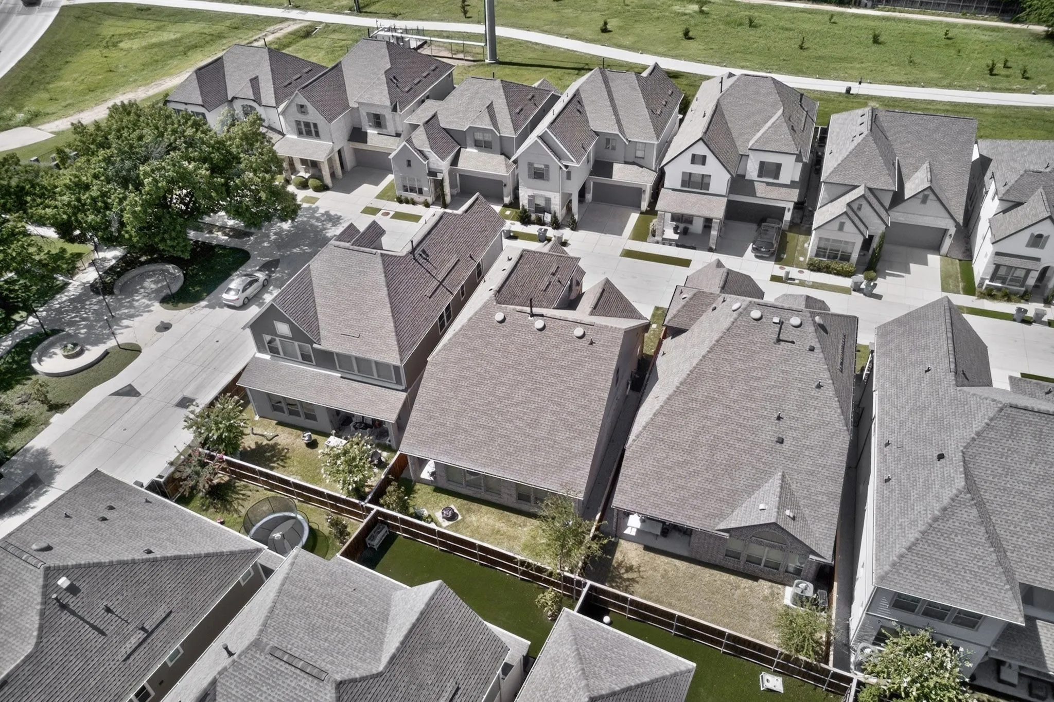 Aerial perspective showcasing a residential street with multiple contemporary homes